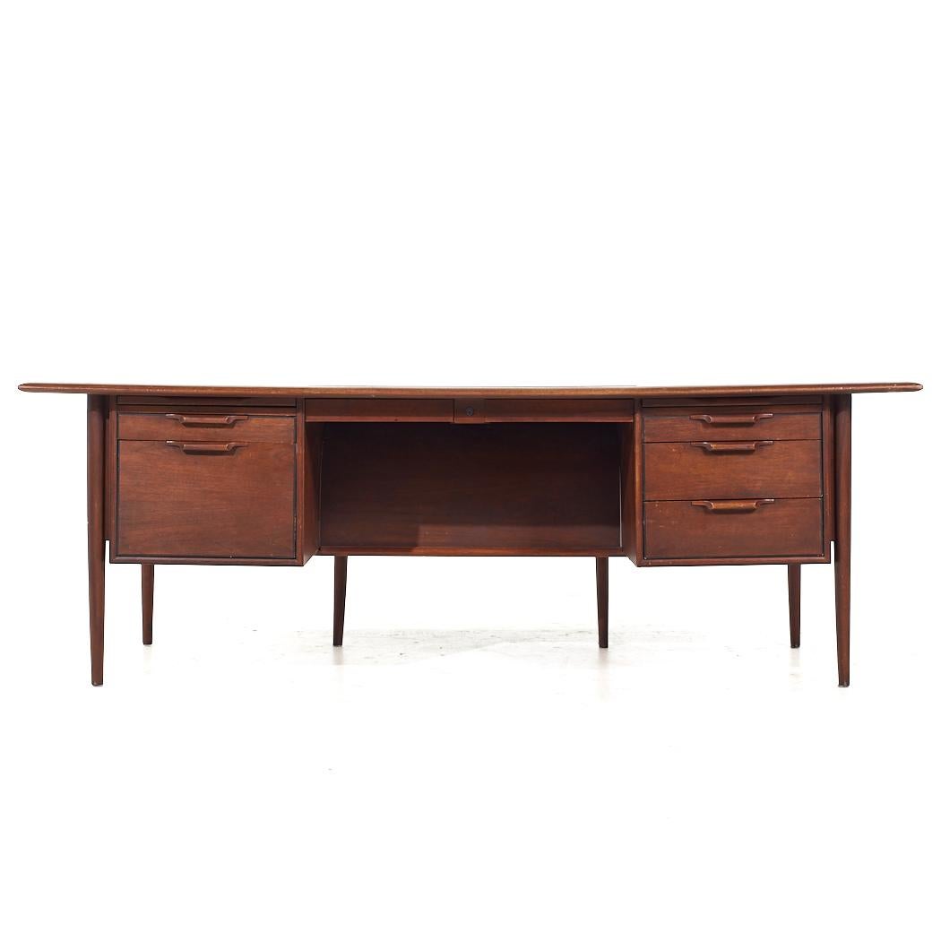 Alma Mid Century Walnut and Leather Executive Desk

This desk measures: 84 wide x 40 deep x 28.75 high, with a chair clearance of 25 inches

All pieces of furniture can be had in what we call restored vintage condition. That means the piece is