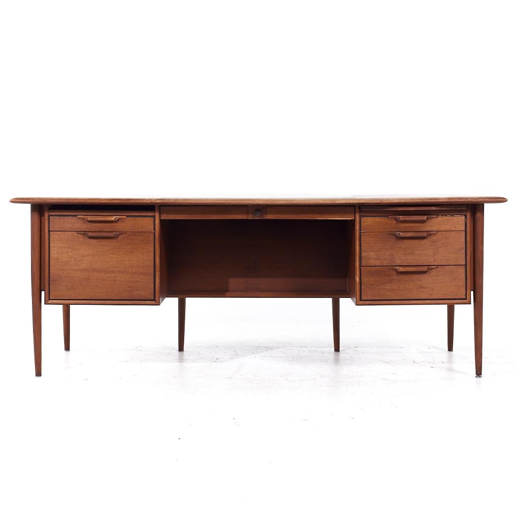 Alma Mid Century Walnut and Leather Executive Desk

This desk measures: 77.75 wide x 38 deep x 29 high, with a chair clearance of 25.25 inches

All pieces of furniture can be had in what we call restored vintage condition. That means the piece is