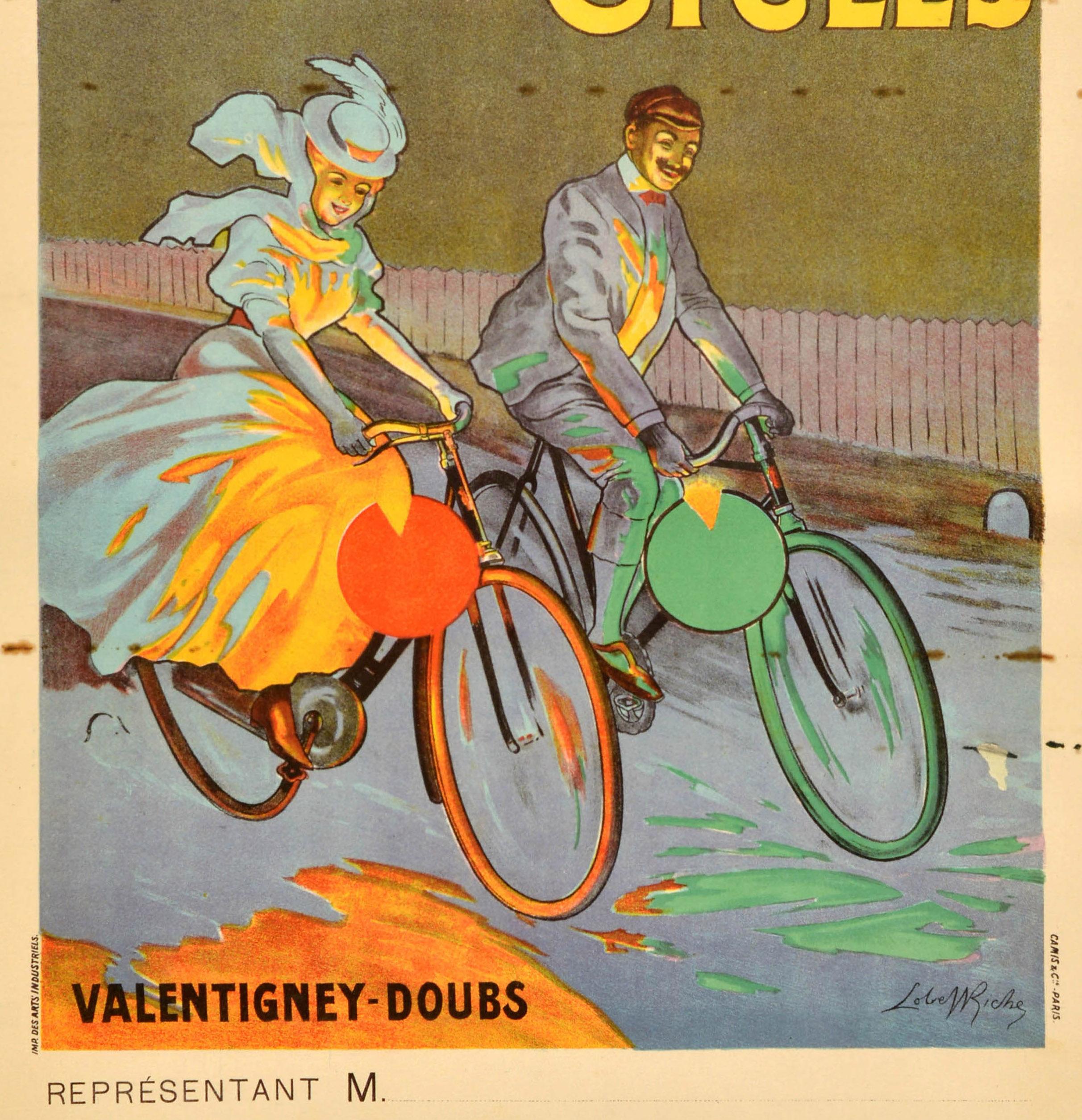 Original antique bicycle advertising poster for Peugeot Cycles featuring a great illustration of a smiling elegant lady in a fashionable dress, flowing scarf and hat and a smartly dressed gentleman cycling on red and green bikes alongside a railway