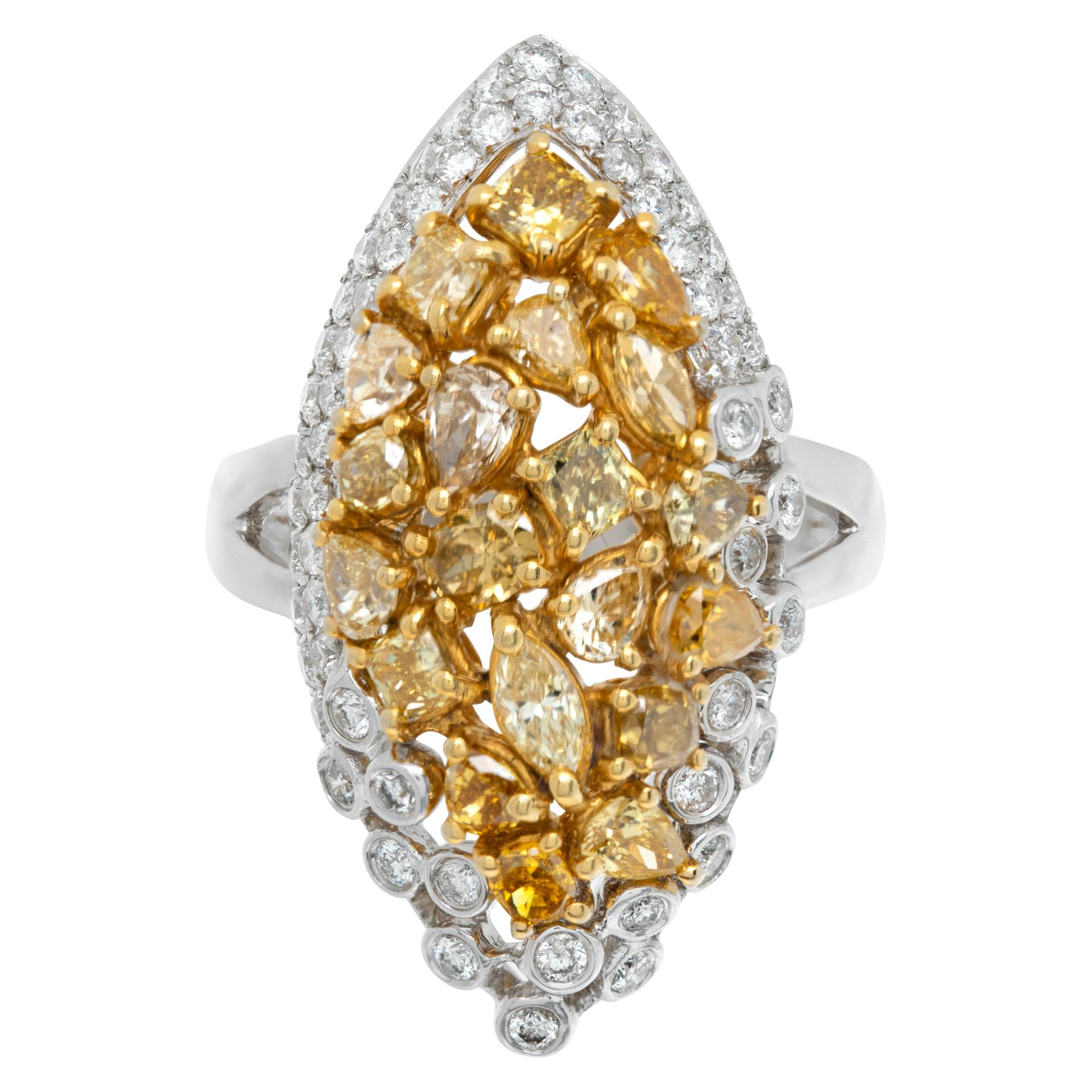 Almond shaped unique 18K White gold ring with 2.26 carats in fancy yellow diamonds and 0.76 carat in round brilliant cut diamonds. Size 6.5, top measures 15mm x 30mm.

This Diamond ring is currently size 6.5 and some items can be sized up or down,