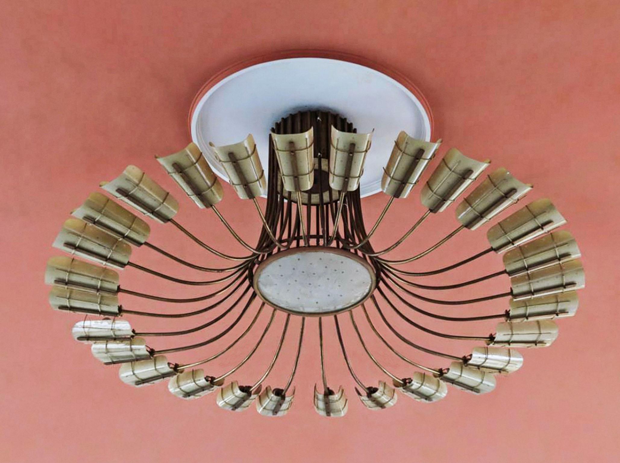 Extraordinary huge ballroom chandelier in brass with glass shades.
The chandelier is an one of a kind production from the 1950s.

To be on the safe side, the lamp should be checked locally by a specialist concerning local requirements.