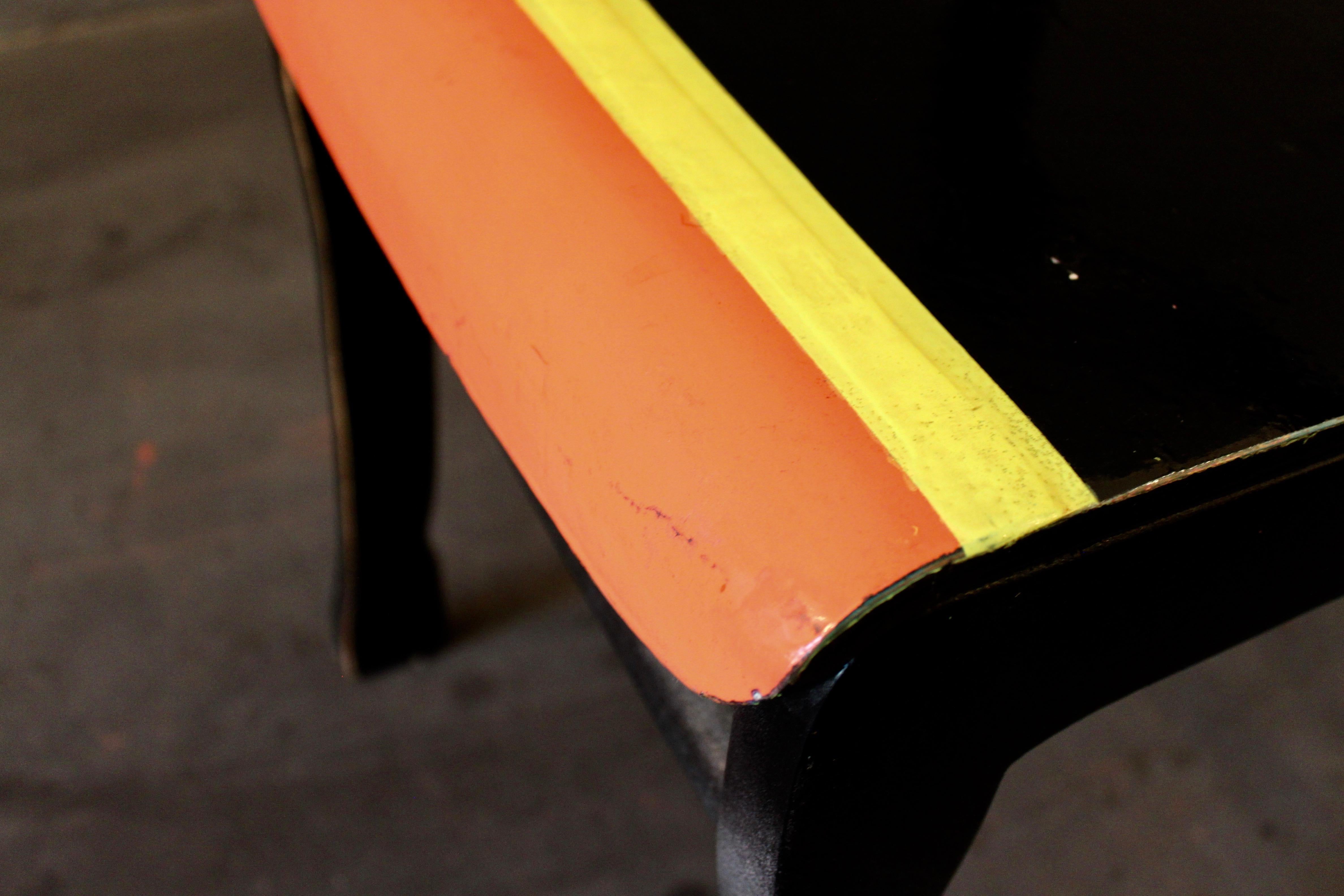 Markus Friedrich Staabs re-work of an early 1970s German design contemporized by re-shaping its original form and mass produced meaning. Painted black with yellow and orange stripes on the seats front, finished with 2K high gloss varnish to preserve