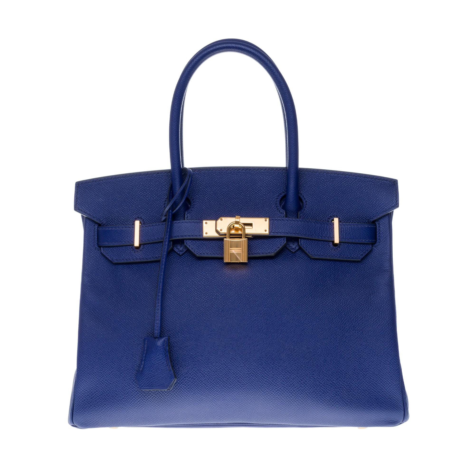 Beautiful Hermes Birkin 30 cm Blue Encre Epsom Leather Handbag with gold-plated metal hardware, double blue leather handle for a handheld.

Closure by flap.
Lining in blue leather, a zipped pocket, a patch pocket.
Signature: 