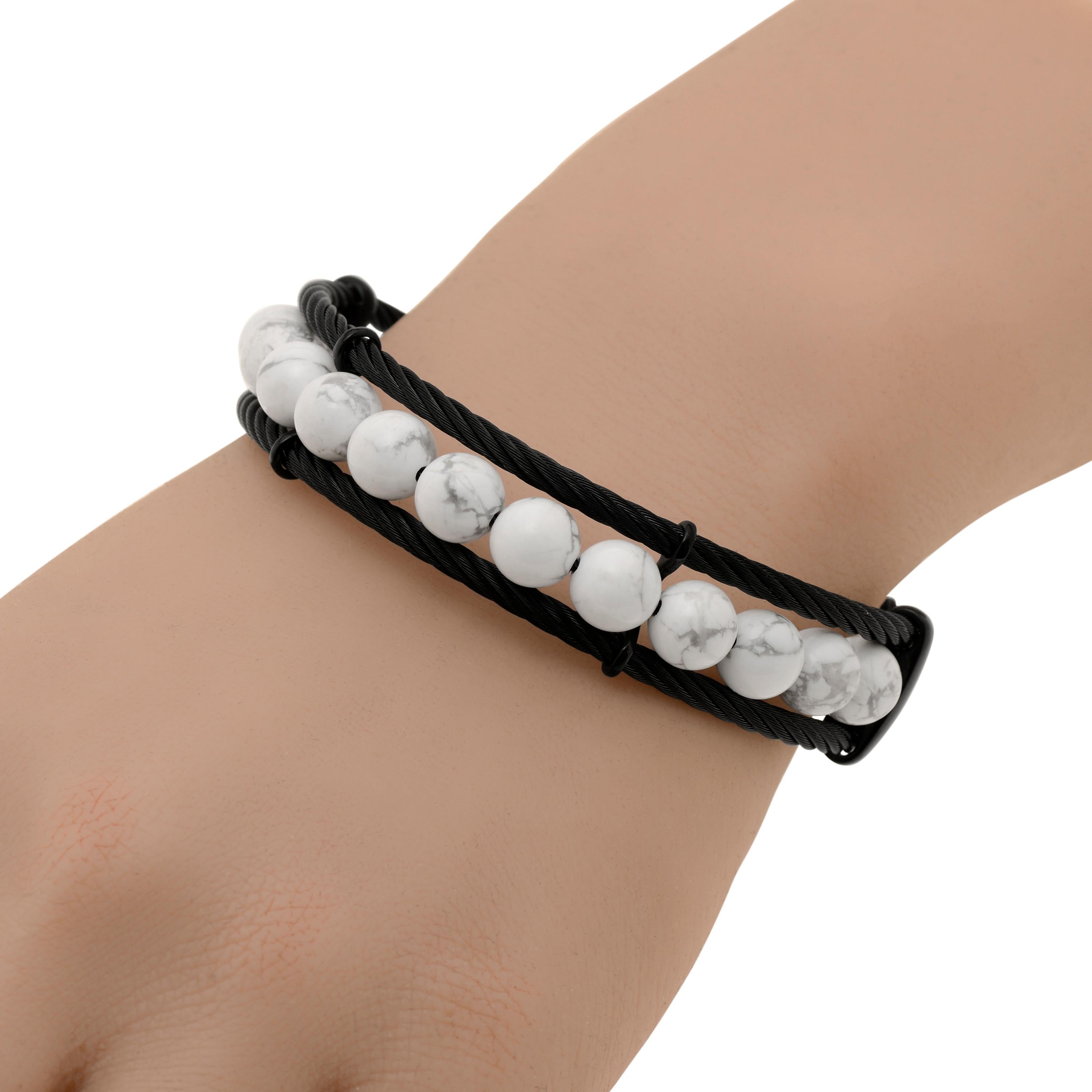 Alor stainless steel cable bracelet features two layers of black cable centered with howlite beads. The band width is 1/2