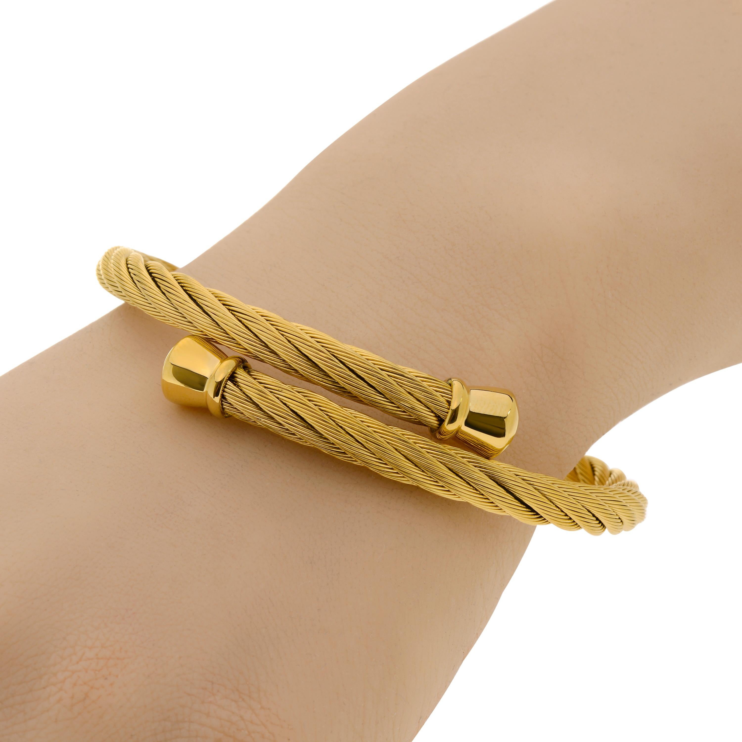 Alor stainless steel wrap bracelet features woven strands of yellow pvd stainless steel with decorative stainless steel end caps. The band width is 6mm. The length is 7.5