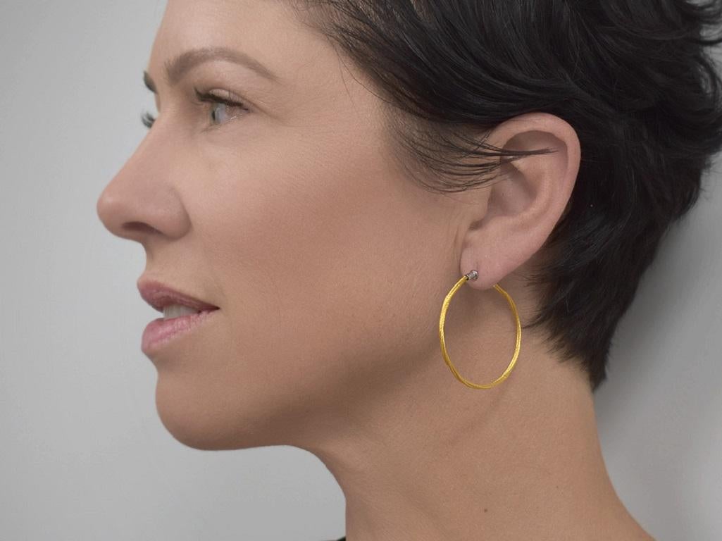 Yellow cable 37mm hoop earrings, 18 karat White Gold, stainless steel.Size: 37mm height (post to bottom) hoop earring. 2mm wide cable.

SKU: 03-37-1001-00

Diamonds: No

Color: Yellow