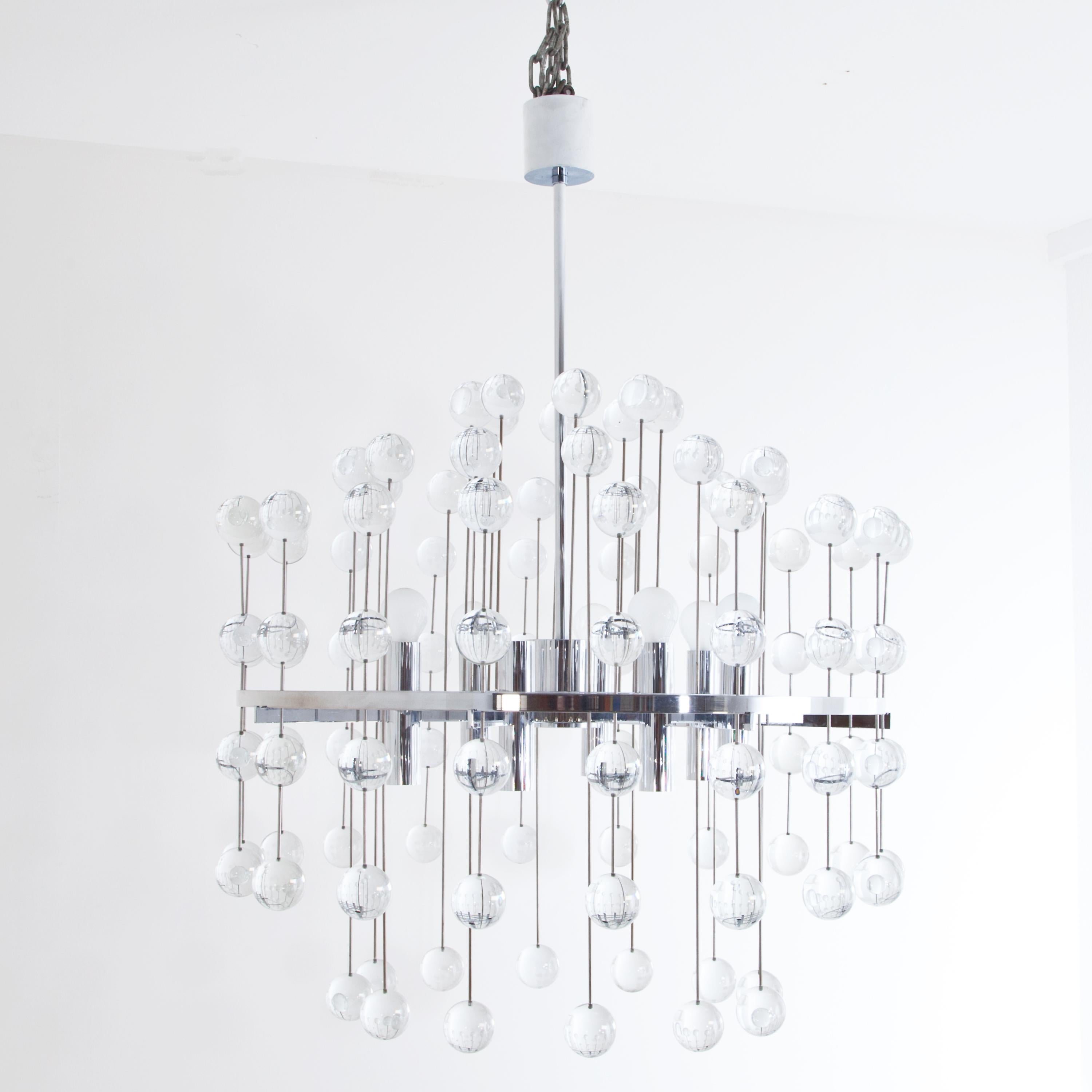 Large ceiling chandelier made of chromed steel with solid glass spheres arranged radially on thin rods.
Aloys Gangkofner (1920 Reichenberg -2003 Munich) equipped numerous public spaces with his lighting fixtures, including the Meistersingerhalle in
