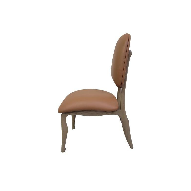 Description: Alp Leather Dining Chair - crafted from solid oak and genuine leather, the alp chair evokes mountain profiles, with timber legs inspired by the vertical drops of undulating slopes.
Color: Tan Leather
Size: 58 x 49 x 60 H cm
Material: