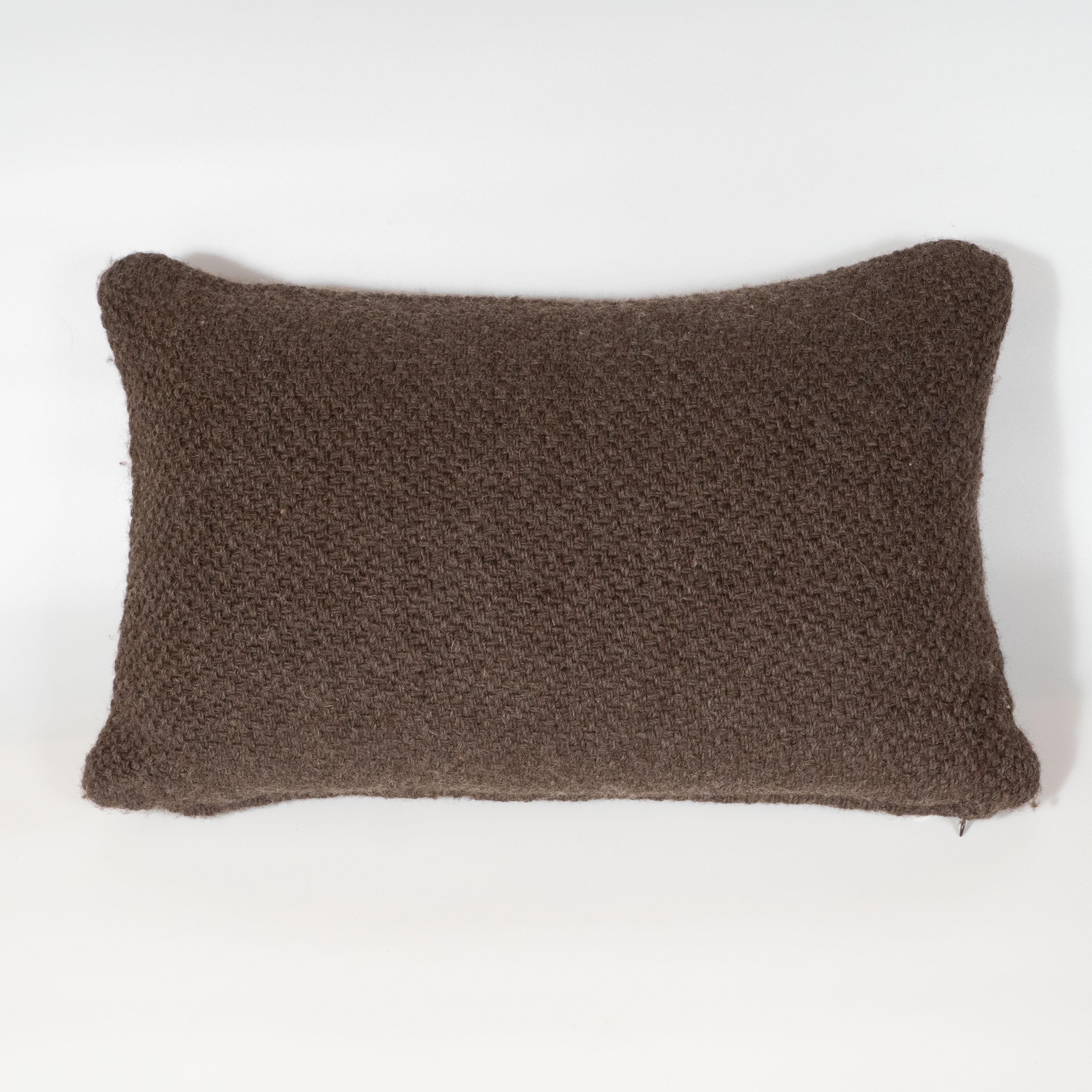 This beautiful espresso pillow is handmade in the mountainous regions of Patagonia, Argentina. Realized in an Alpaca/Merino wool blend, it offers a basket weave pattern in heather. Soft, luxuriously, and exquisitely crafted, this pillow promises to