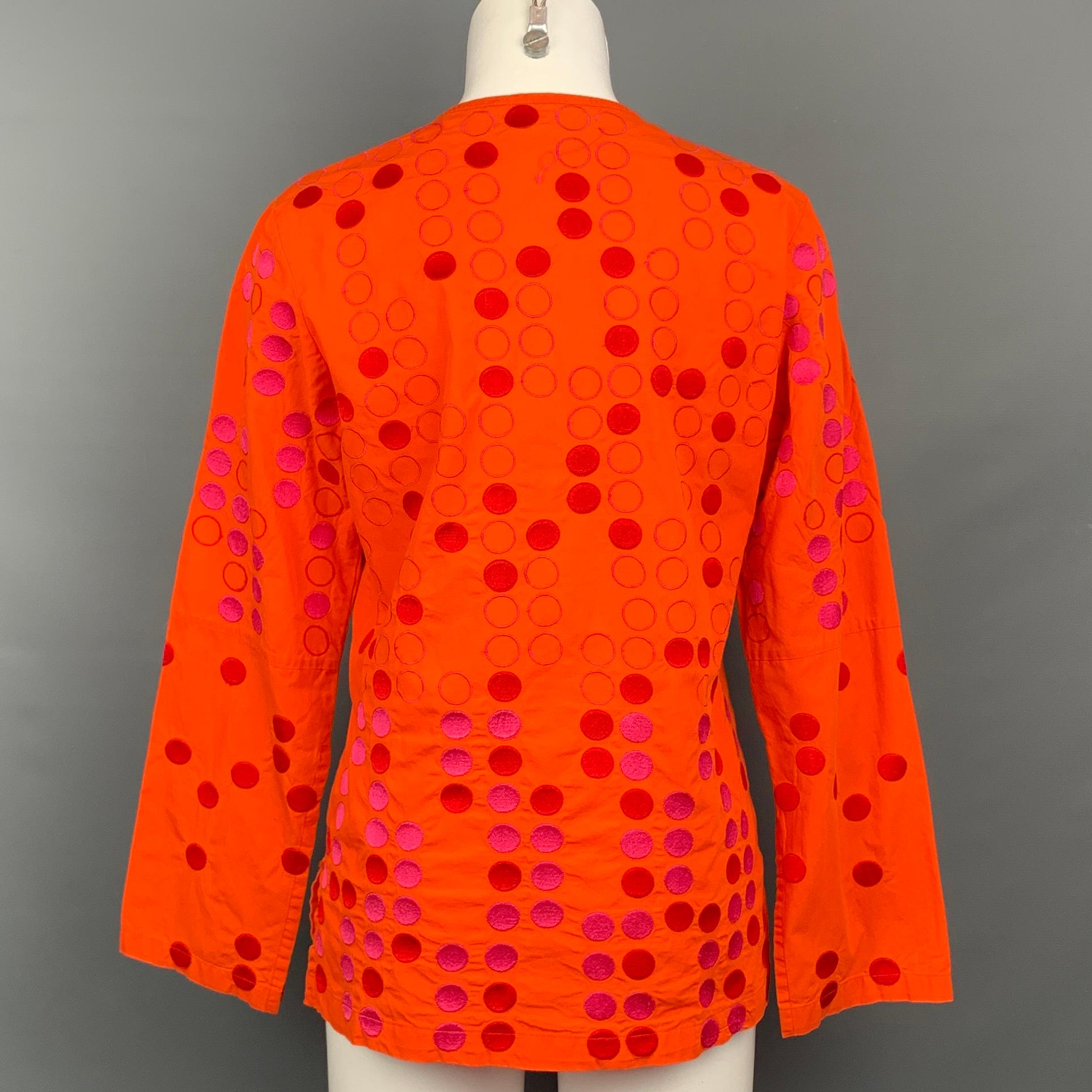 ALPANA BAWA blouse comes in a orange & fuchsia cotton featuring a v-neck ans slit sleeves. 

Very Good Pre-Owned Condition.
Marked: M

Measurements:

Shoulder: 16 in.
Bust: 38 in.
Sleeve: 24 in.
Length: 25.5 in. 