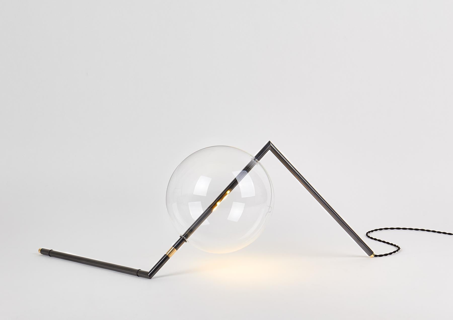 Designed to be positioned on the floor or on a console, the Alpi Floor/Table Lamp is a work of Abstract Art for the home. The exact arrangement of this Sculptural Decorative Piece can be adjusted using the nickel ring, and with the “inline Touch