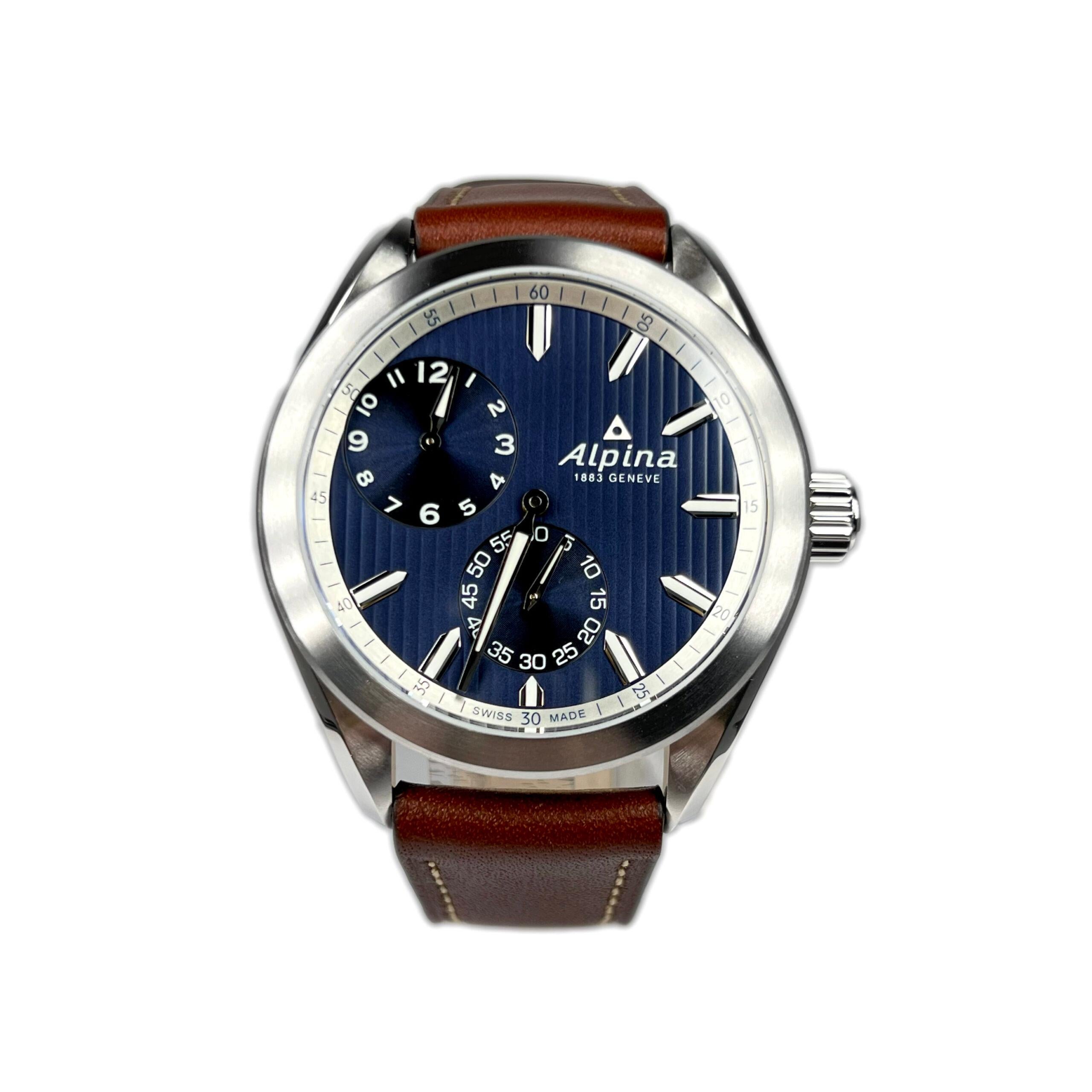 This Men’s Watch has a 45 mm silver-tone stainless steel case with a brown leather strap. Fixed silver-tone stainless steel bezel. Blue dial with silver-tone hands and index hour markers. Minute markers around the outer rim. Dial Type: Analog.