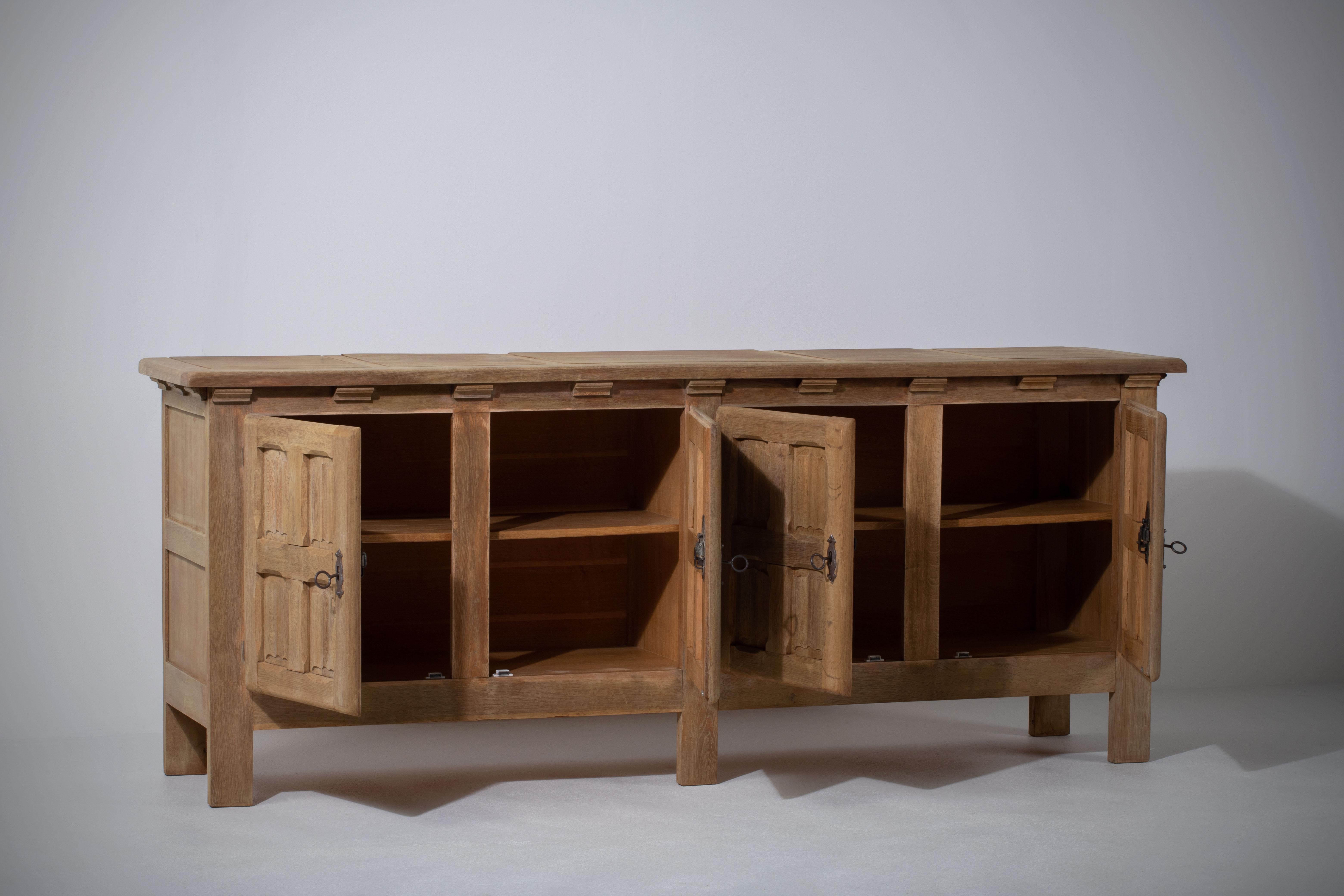 This characteristic cabinet, buffet in solid oak was inspired by the work of French designer duo Guillerme et Chambron or Charlotte Perriand.

Unearthed in a chic chalet near Chamonix, this sideboard from the 60s offers an authentic and warm
