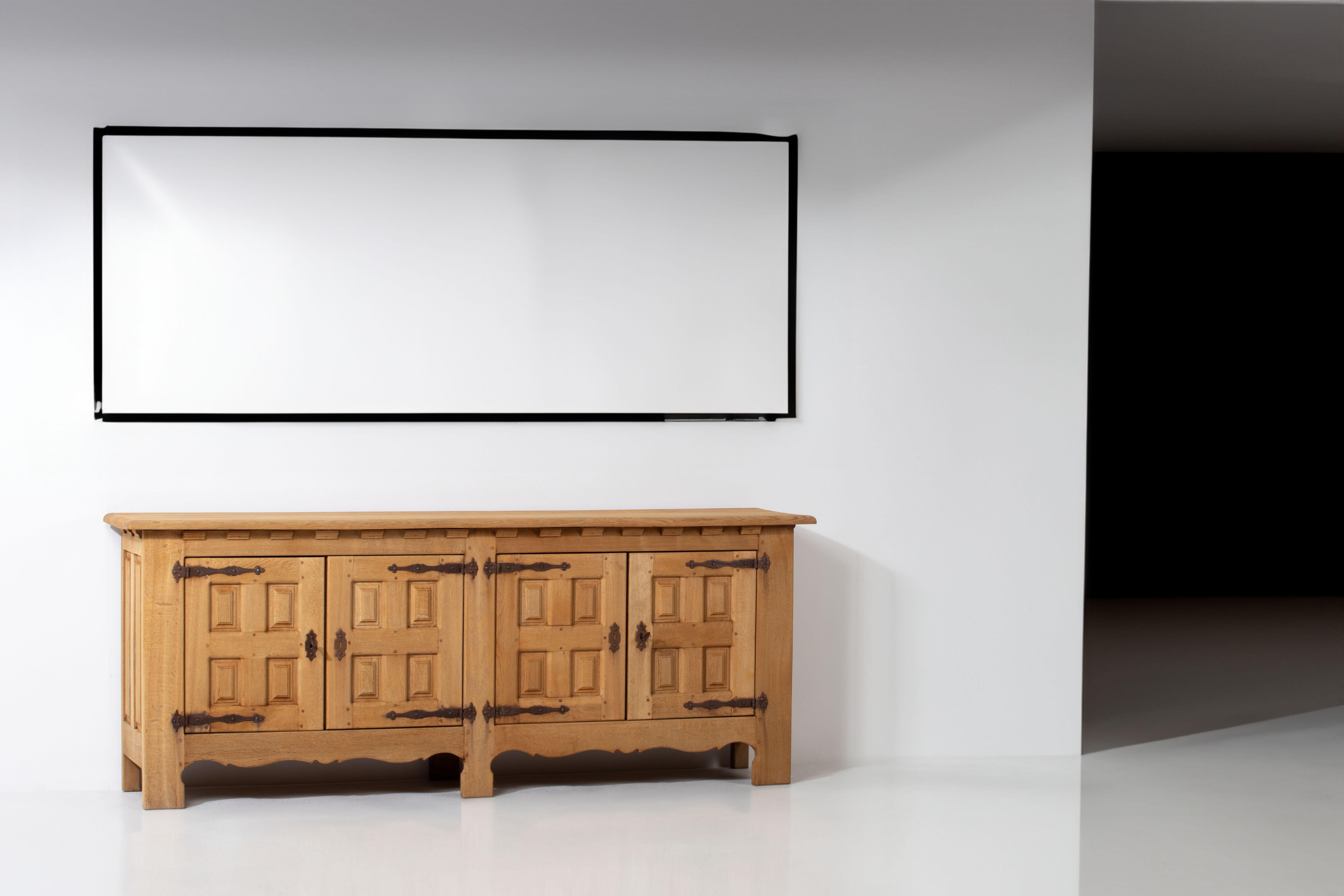 Step into the world of authentic French design with this exquisite cabinet, a delightful sideboard crafted from solid oak and inspired by the renowned French designer duo Guillerme et Chambron. Unearthed in a chic chalet nestled in the picturesque