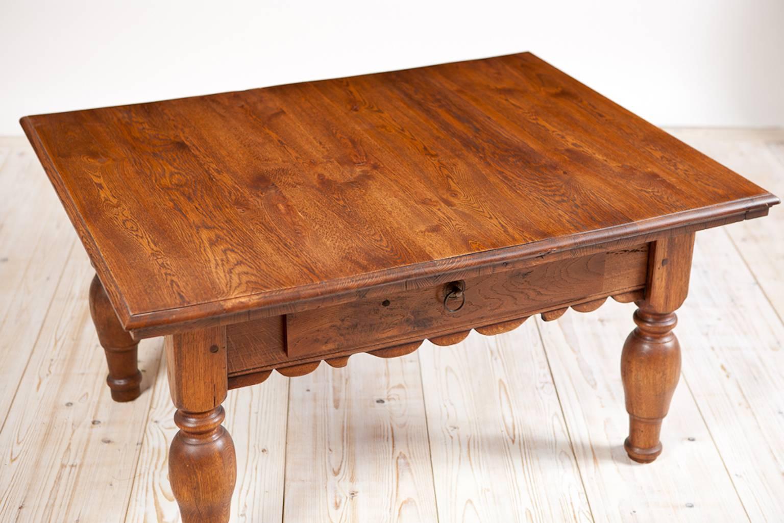 A charming Alpine table in oak with plank-top, carved apron, turned legs and one drawer. Table was originally taller and was modified for use as a coffee table. Austria, circa 1890.
Measures: 43