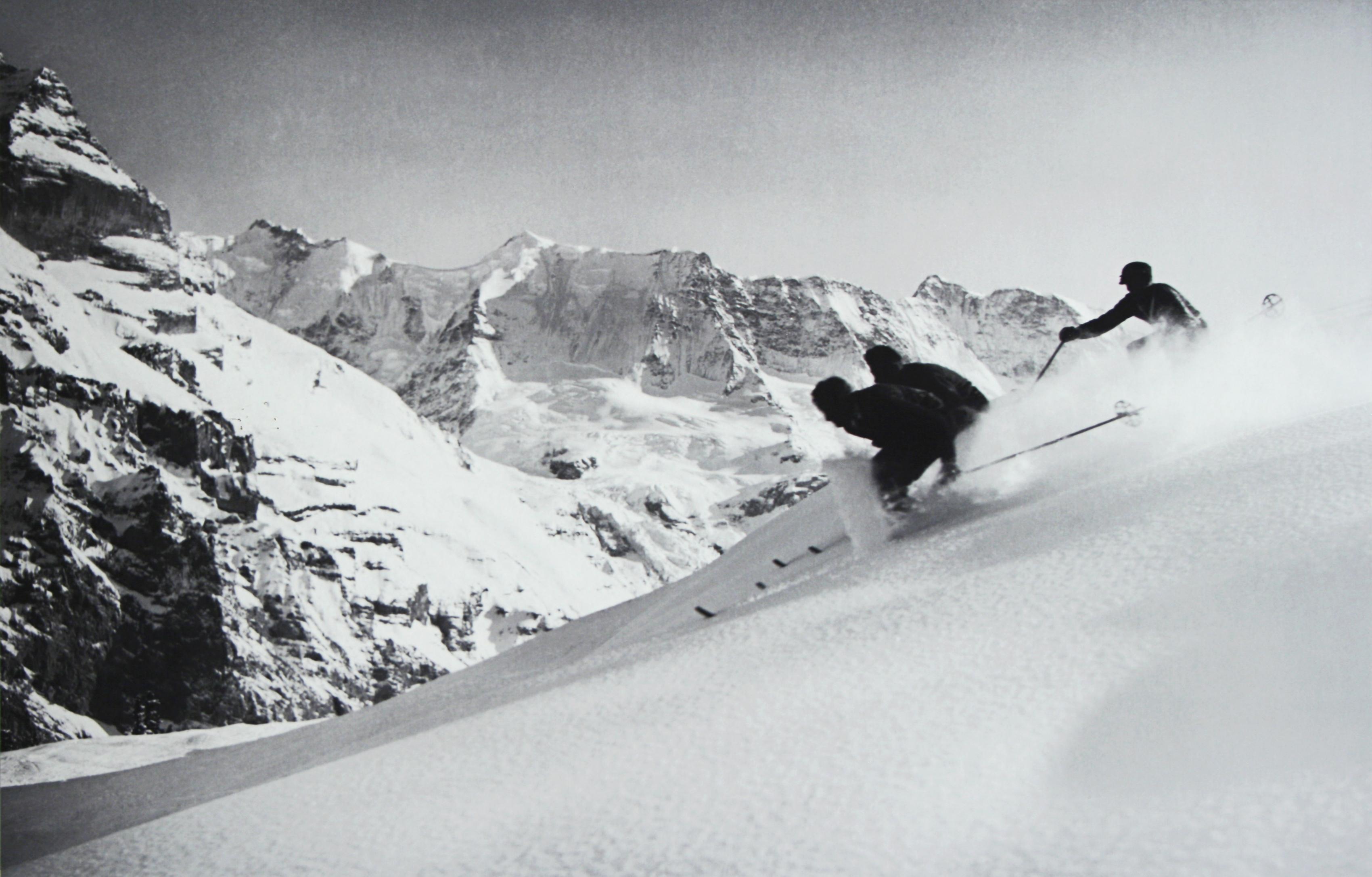 Alpine Ski photograph.
'SCHUSS' Murren, Switzerland, a new mounted black and white photographic image after an original 1930s skiing photograph. Prior to being a recreational activity skiing was purely a means of travelling from A to B through the