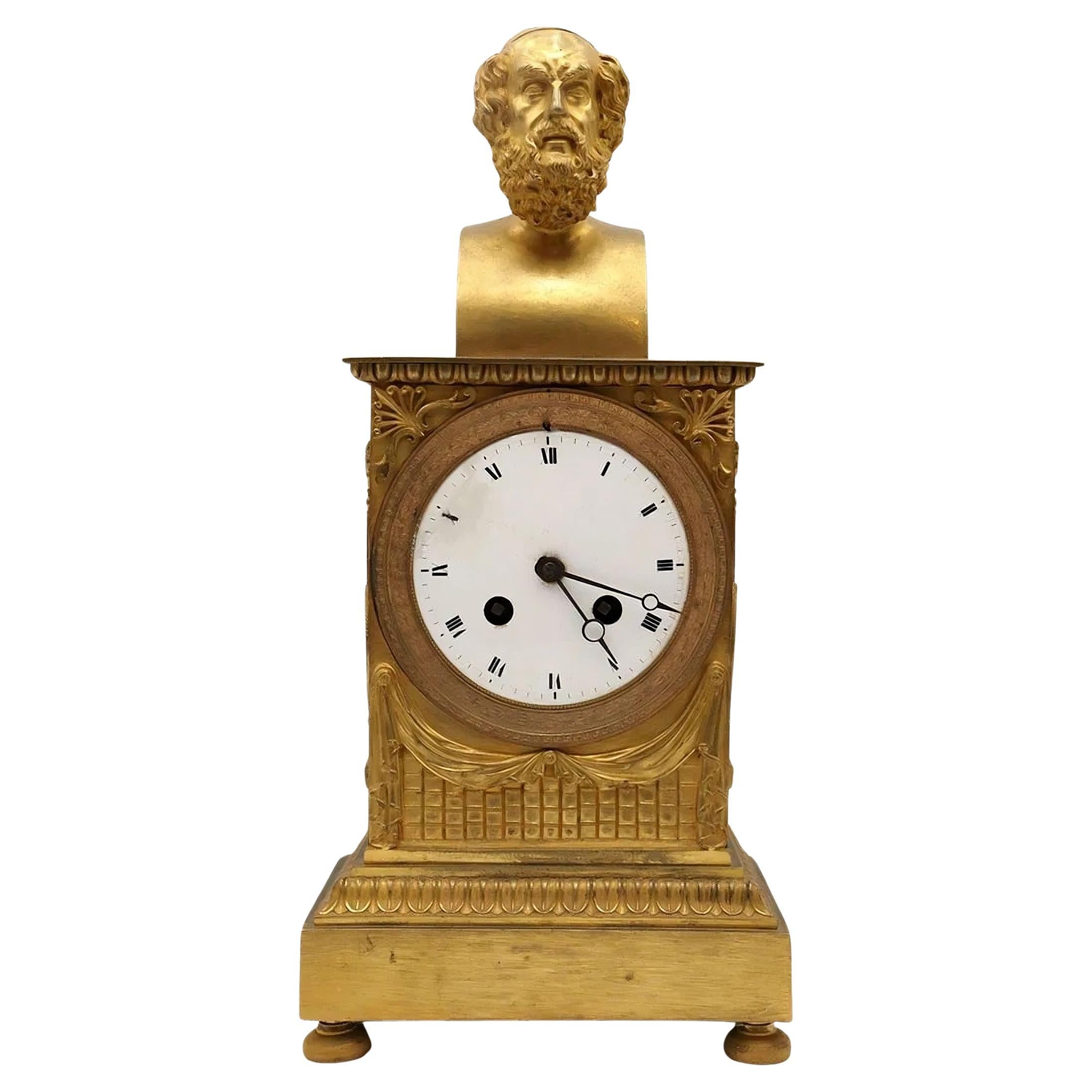 A Homer bust ormolu empire clock in the manner of Thomire