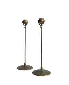 A matched pair of Tiffany Studios Etruscan bronze Candlesticks