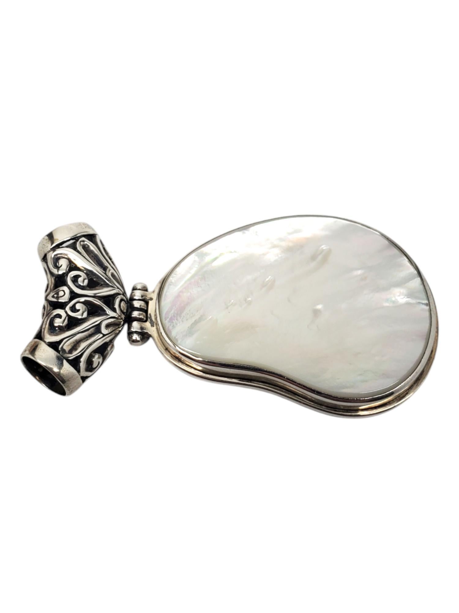 ALS Sterling Silver Mother Of Pearl Pendant

This lovely pendant features a pear shape mother of pearl (46.2 mm x 33.3 mm) in sterling silver with a large hinged bail by ALS.

Size: 72.3 mm x 36.9 mm

Stamped: ALS 925

Weigh: 17.2 dwt / 26.78