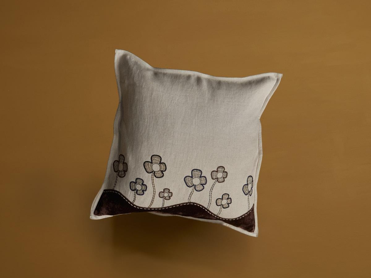 Exclusive cushion cover crafted from fine beige linen with brown silk velvet and further embellished with brown flowers made by hand. Duck feather fillers can be ordered seperately. Size 50 x 50 cm.