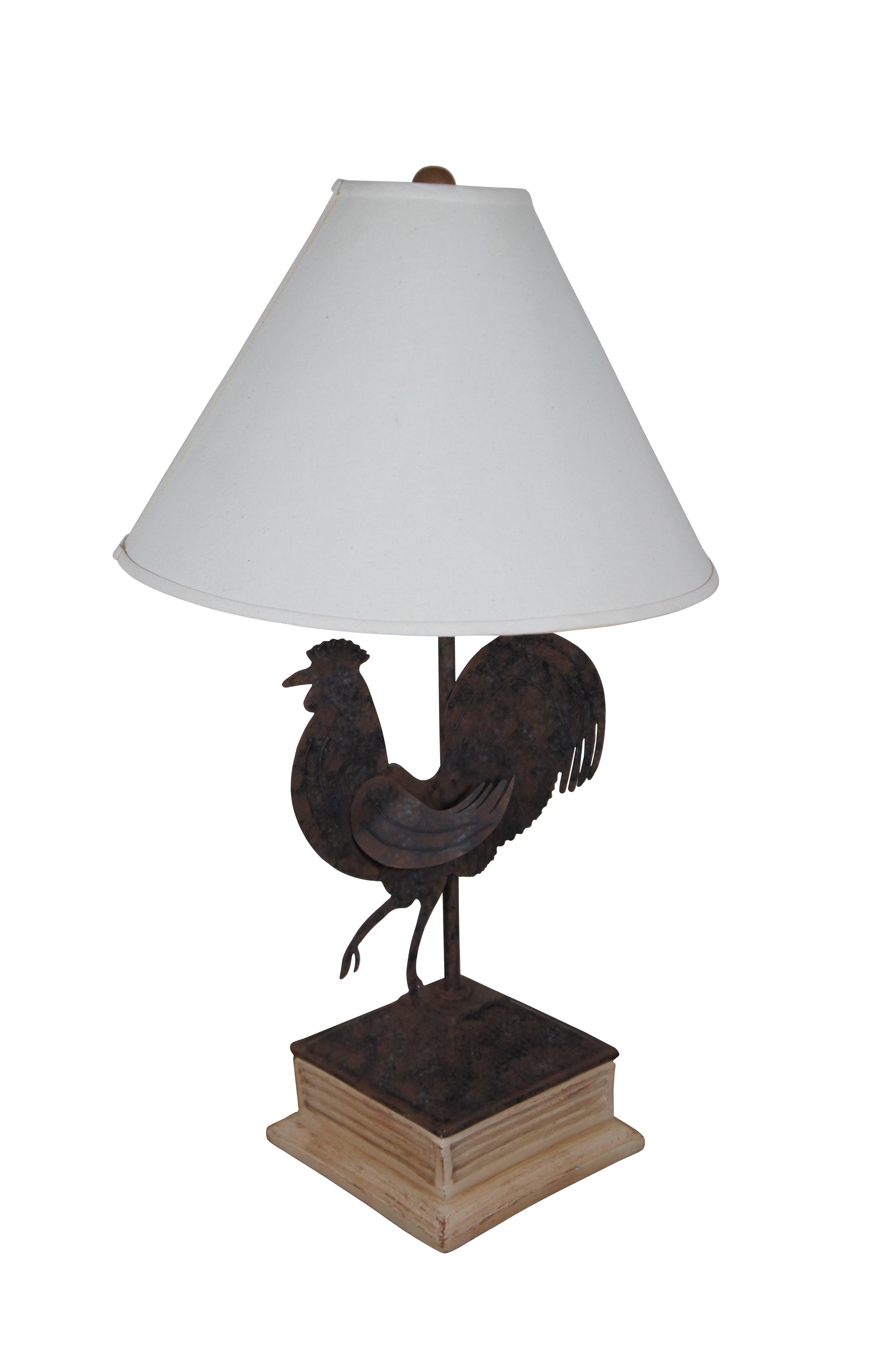 Late 20th century Cresswell Ltd table lamp featuring a white resin cupola shaped base, topped with a metal cap and sillhouette of a rooster / chicken / bird, such as wood decorate the lower part of a weather vane.ncludes harp, wood ball finial, and