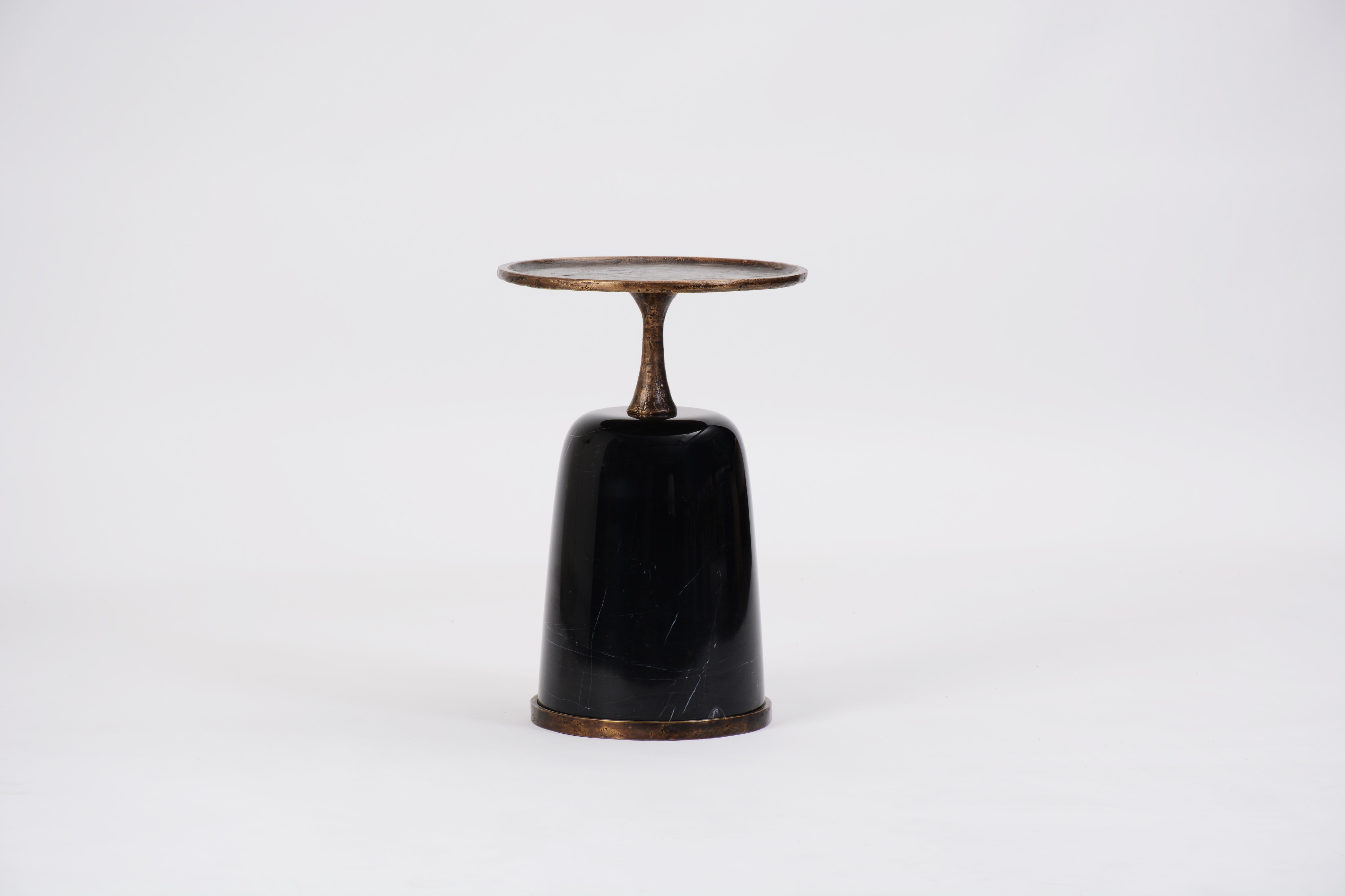 The Altai side table is a marble and bronze sculpture. Cast using the lost wax method, the textured bronze is reminiscent of a Giacometti sculpture.

The solid marble base is stocked in black but also available in white marble. Custom sizes and