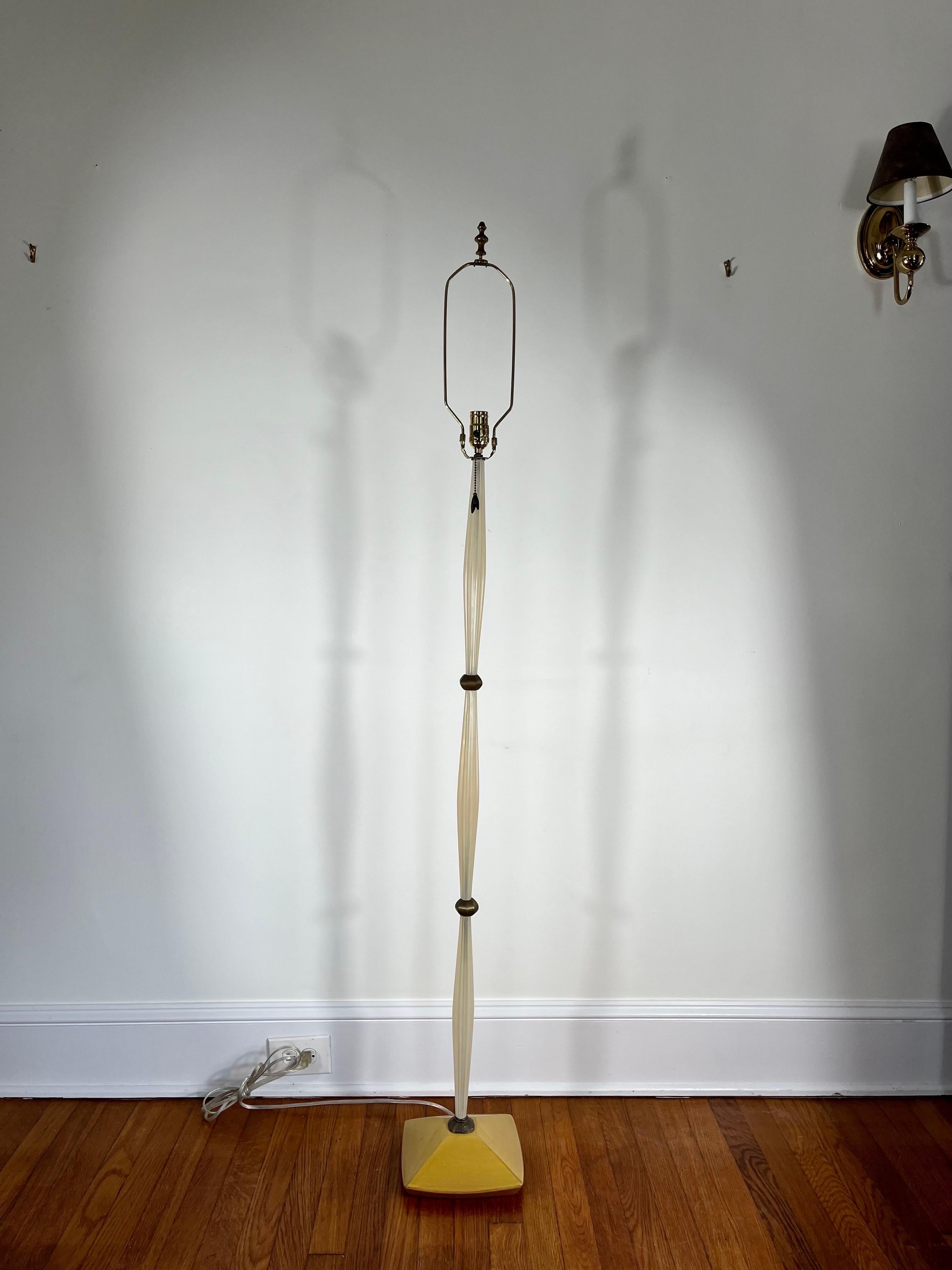 ALTAMIRA by MICHAEL LAMAR floor lamp. Artisan Hand Crafted Acrylic floor amp. Glazed Ceramic Base. MICHAEL LAMAR has been designing and creating innovative, colorful and whimsical lamps for more than 25 years and has been teaching at the Rhode
