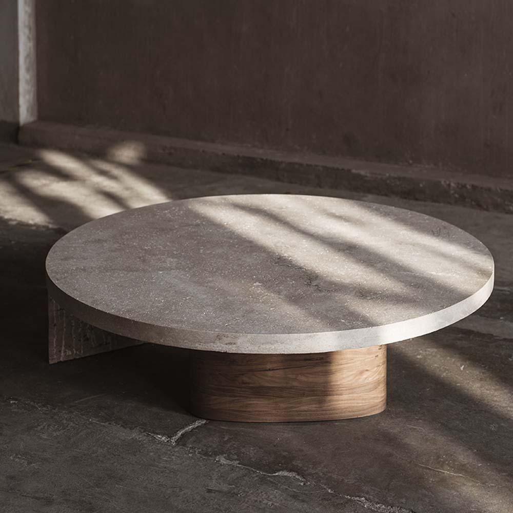 Sculptural coffee table in Jalapa travertine & walnut. Inspired by flat-topped blocks used for religious rituals and ceremonies, especially for sacrifices or offerings to the deities.

The altar coffee table has been hand carved and is related to