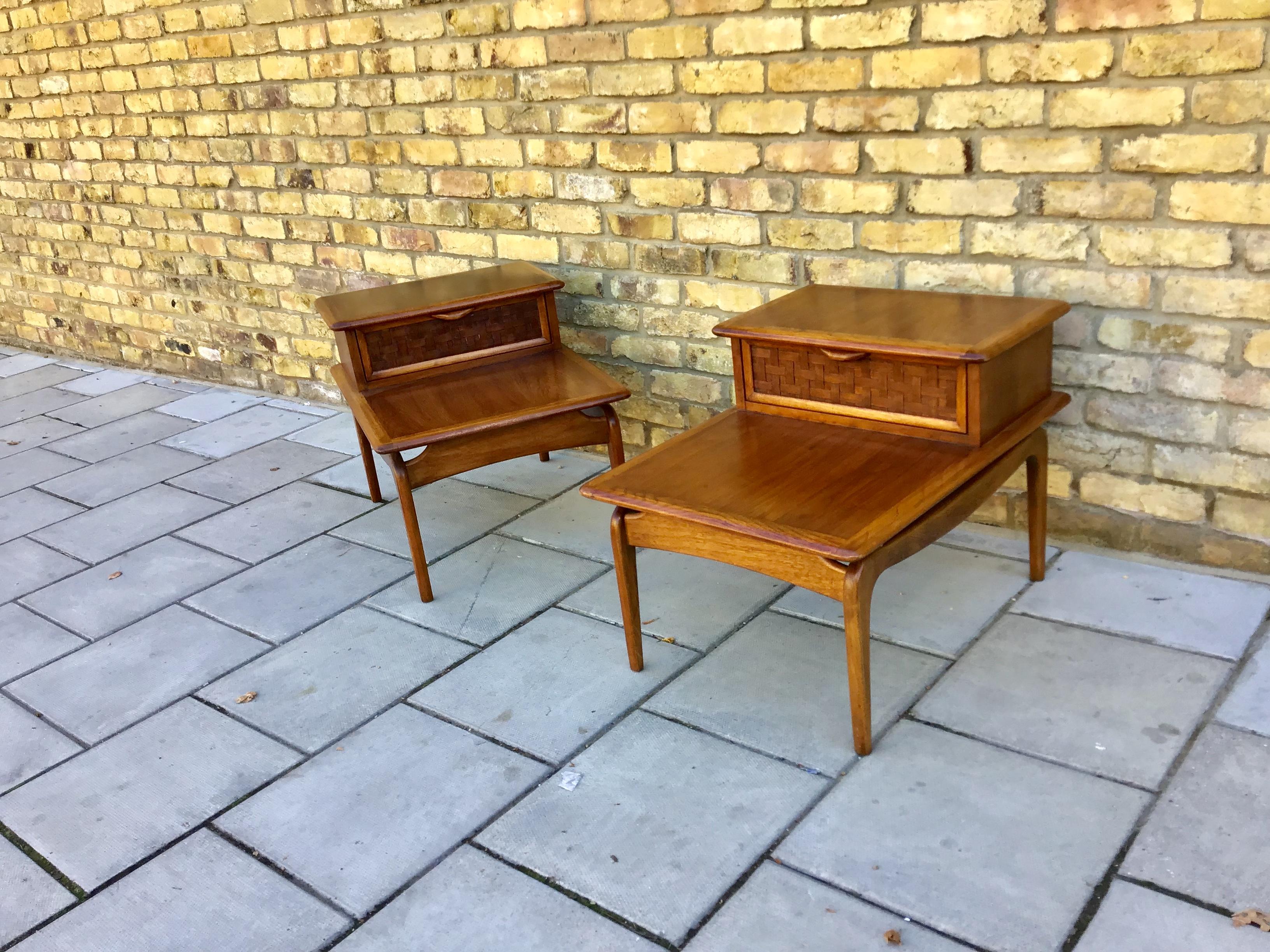 Two level pair of 1950s oak and walnut side tables with storage 
Draws by Andre Bus for Altavista Lane Furniture Cc USA.