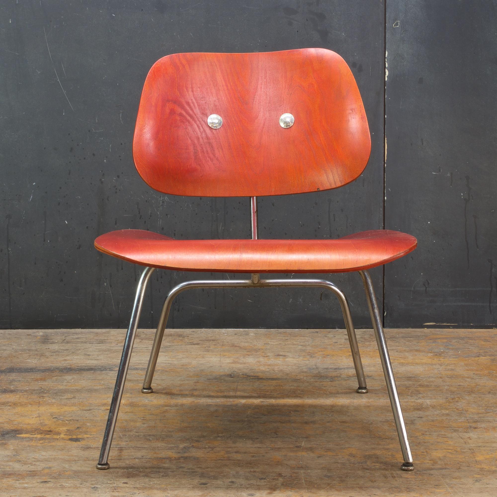 This vintage 1940s-1950s Eames LCM chair that is unrestored, the back rubber mounts have been drilled through to connect the back rest. This is a fully functional chair as shown.

We used silver 1964 Kennedy Half Dollars bolts to cover the holes and