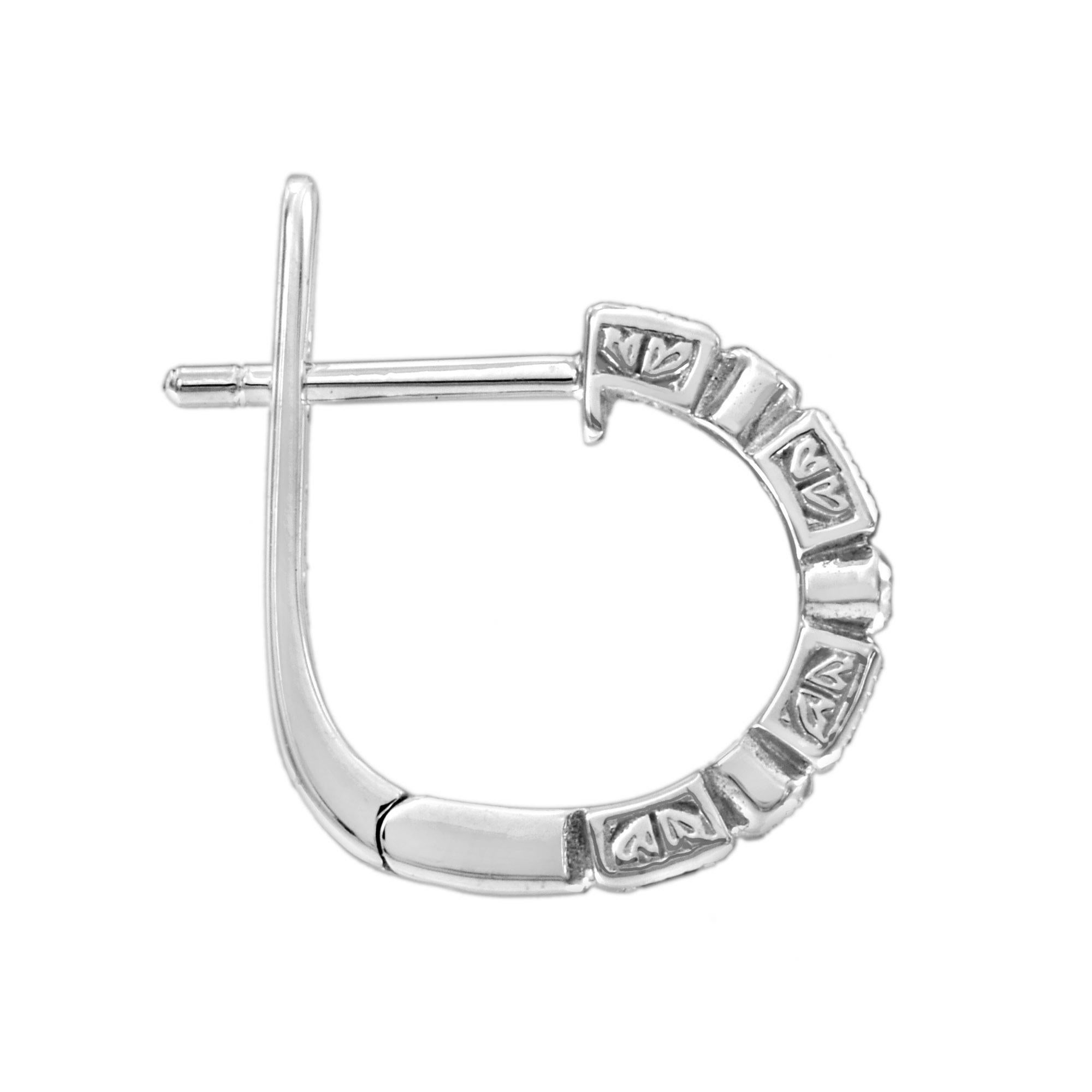 Inspired by the Art Deco period, these earrings features alternate baguette blue sapphire and round brilliant cut diamond, elegantly framed by a millgrain edge. The earrings are available as a special order in any gemstones