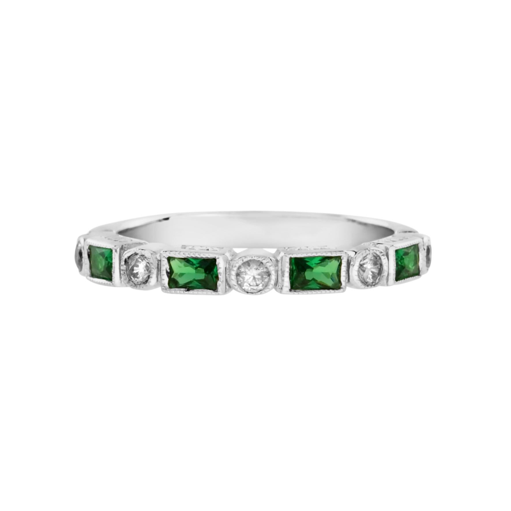 Inspired by the Art Deco period, this Aimée ring features 0.62 carats of alternate round brilliant cut diamonds and baguette emerald, elegantly framed by a millgrain edge. This white gold band is the perfect alternative half eternity ring. The ring