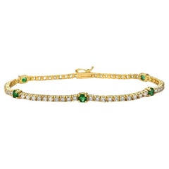 Tennisarmband aus 14 Karat Gold mit abwechselnd Diamanten und runden Smaragden (3,25 Karat) und 4 Zacken