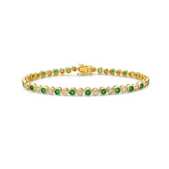 Tennisarmband mit abwechselnd Diamanten und Smaragden (4,00ct.) Lünette in 14K Gold gefasst