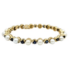 Bracelet à maillons alternés de saphirs bleus et de perles de culture en or jaune 18 carats