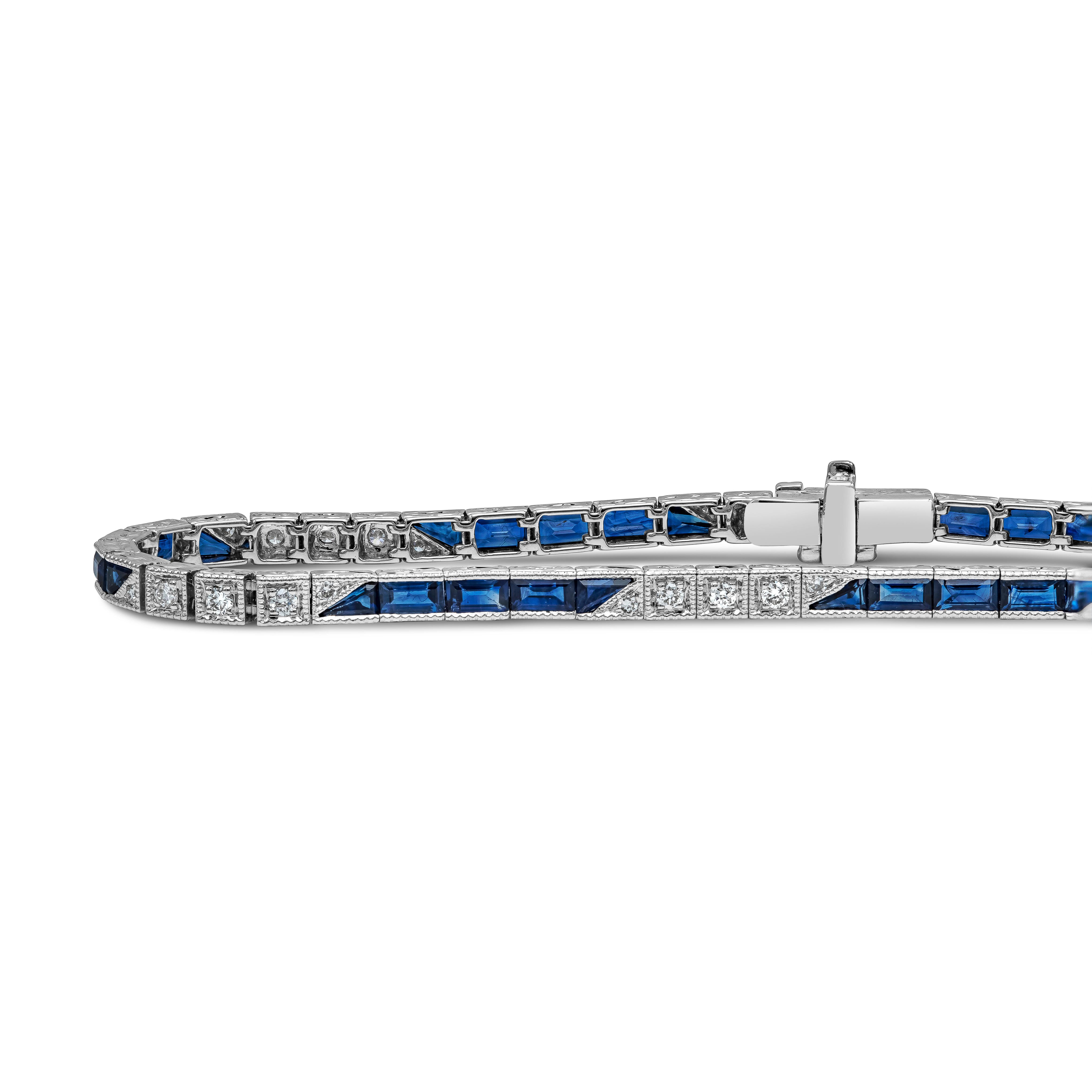 An antique-looking bracelet showcasing vibrant blue sapphires, alternating with round brilliant diamonds set in a beaded-edge tennis bracelet style. Made in 18k white gold. Sapphires weigh 4.39 carats total; diamonds weigh 0.35 carats total. 

Roman