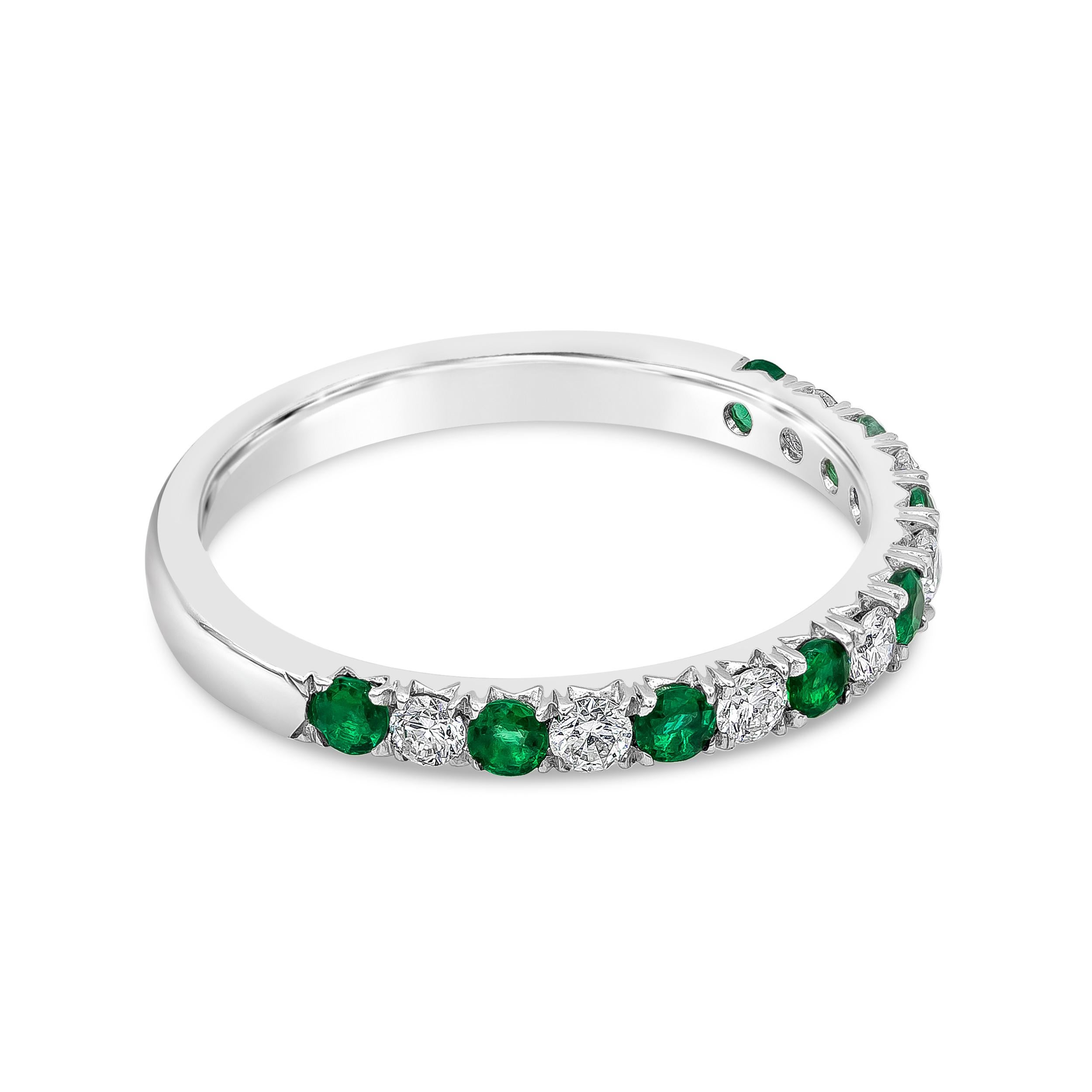 A fashionable and classic wedding band showcasing color-rich green emeralds weighing 0.29 carats total that alternate with brilliant round diamonds weighing 0.23 carats total. Stones secured with a french pave setting made in 18K White Gold. Size