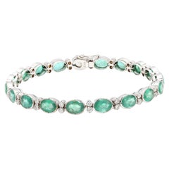 Bracciale tennis con smeraldo alternato a diamanti da 14,15 carati in oro bianco 18 carati