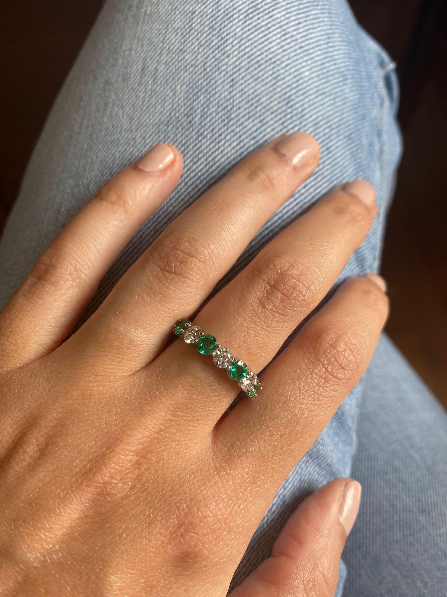 8 Emeralds weighing 1.65 Carats
8 Round Diamonds weighing 1.92 Carats.
Set in Platinum.
Size 6.

Also available in Blue Sapphires, ink Sapphires and Rubies. Can be ordered in any size.