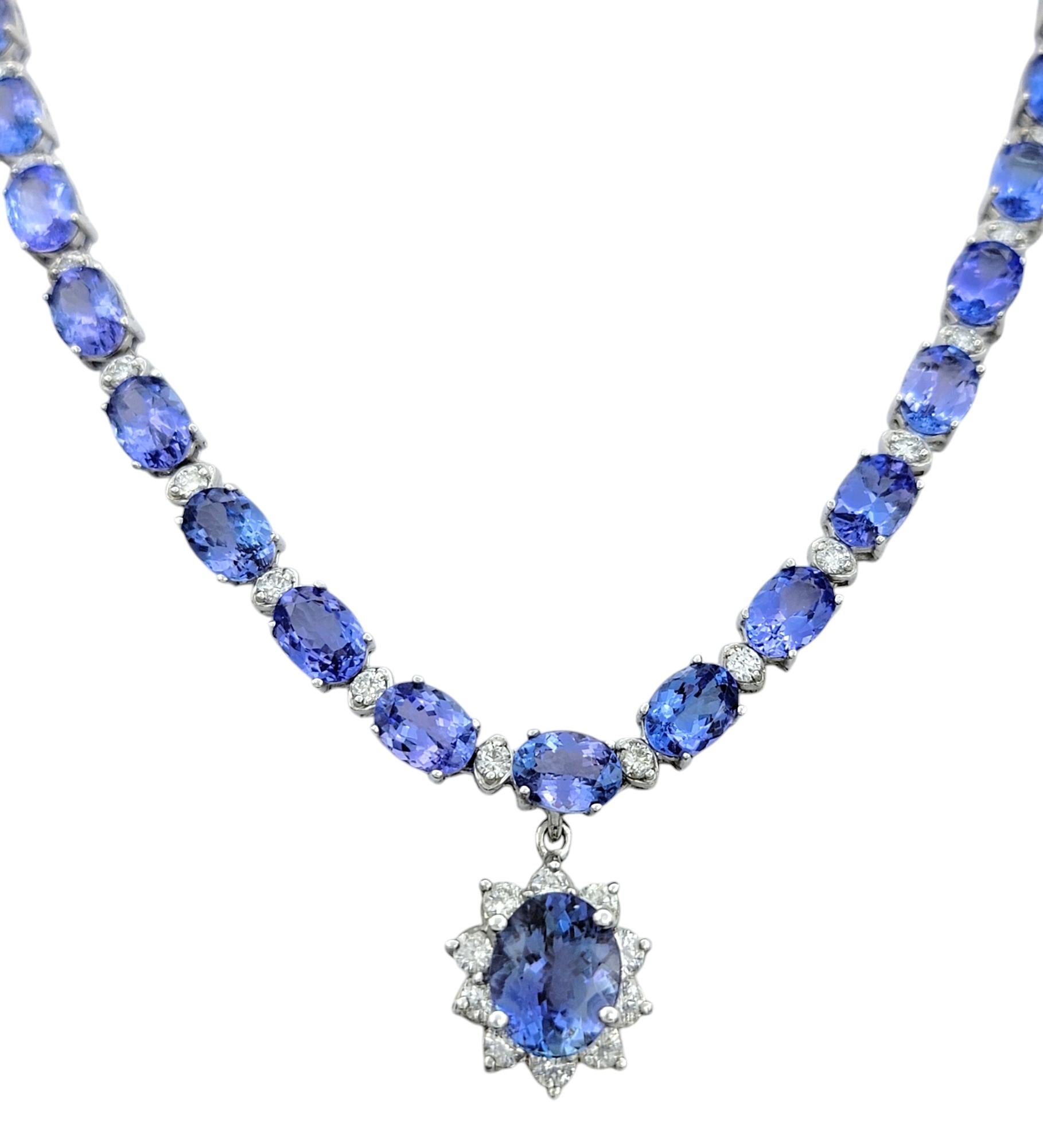 Make a bold statement with this exquisite tanzanite and diamond collar-length necklace, a breathtaking masterpiece crafted in 14 karat white gold. Designed to captivate, this luxurious necklace features a striking oval-shaped tanzanite pendant,