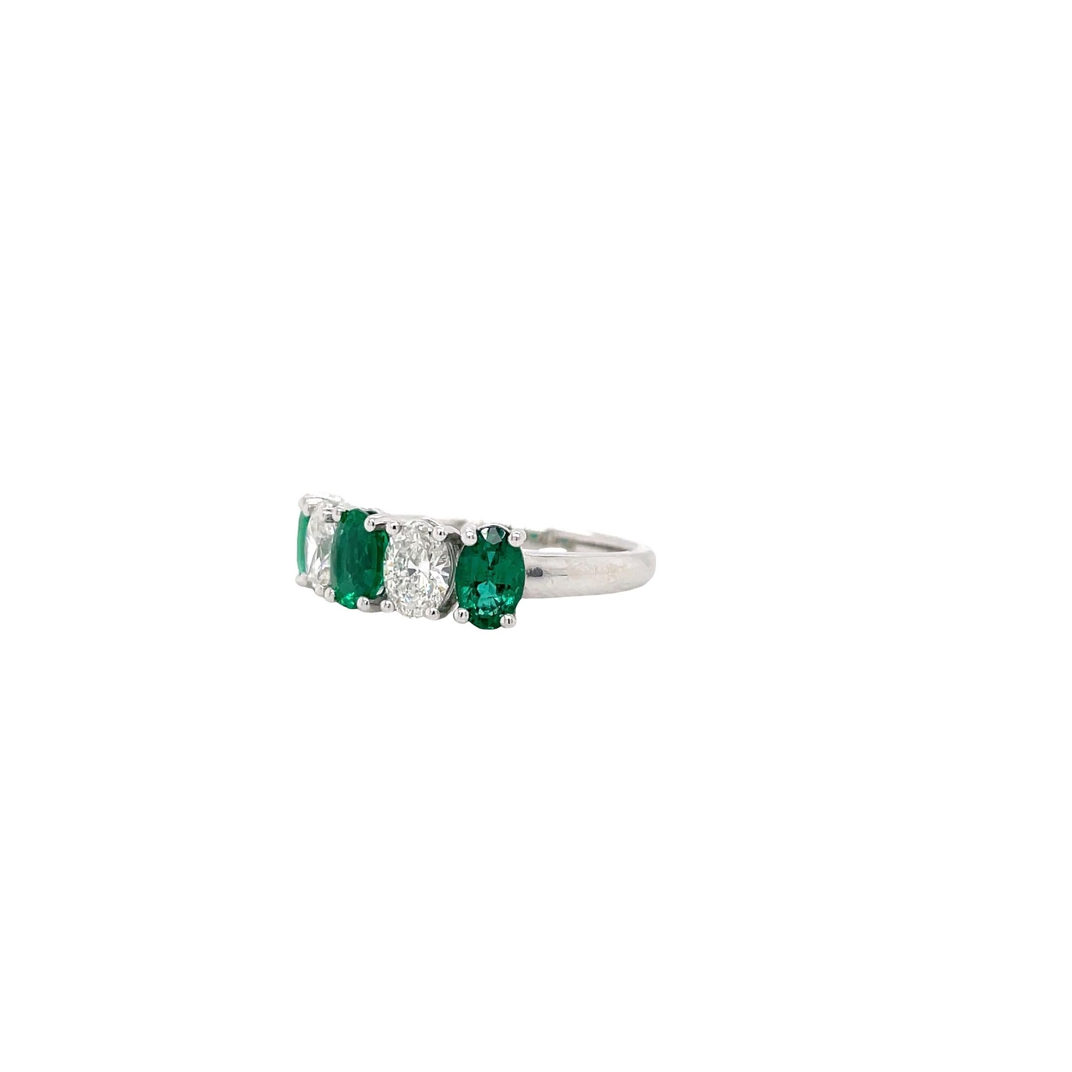 Ring contains 3 oval cut emeralds, 1.36tcw and 2 oval cut diamonds, 0.81tcw. Diamonds are G in color and VS2 in clarity. All stones are mounted in a handmade basket prong setting. Ring is a size 6.75 and can be resized to desired measurement. 

All