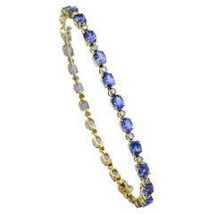 Alternating Oval Tanzanite and Round Diamond Line Bracelet 18 Karat Yellow Gold
