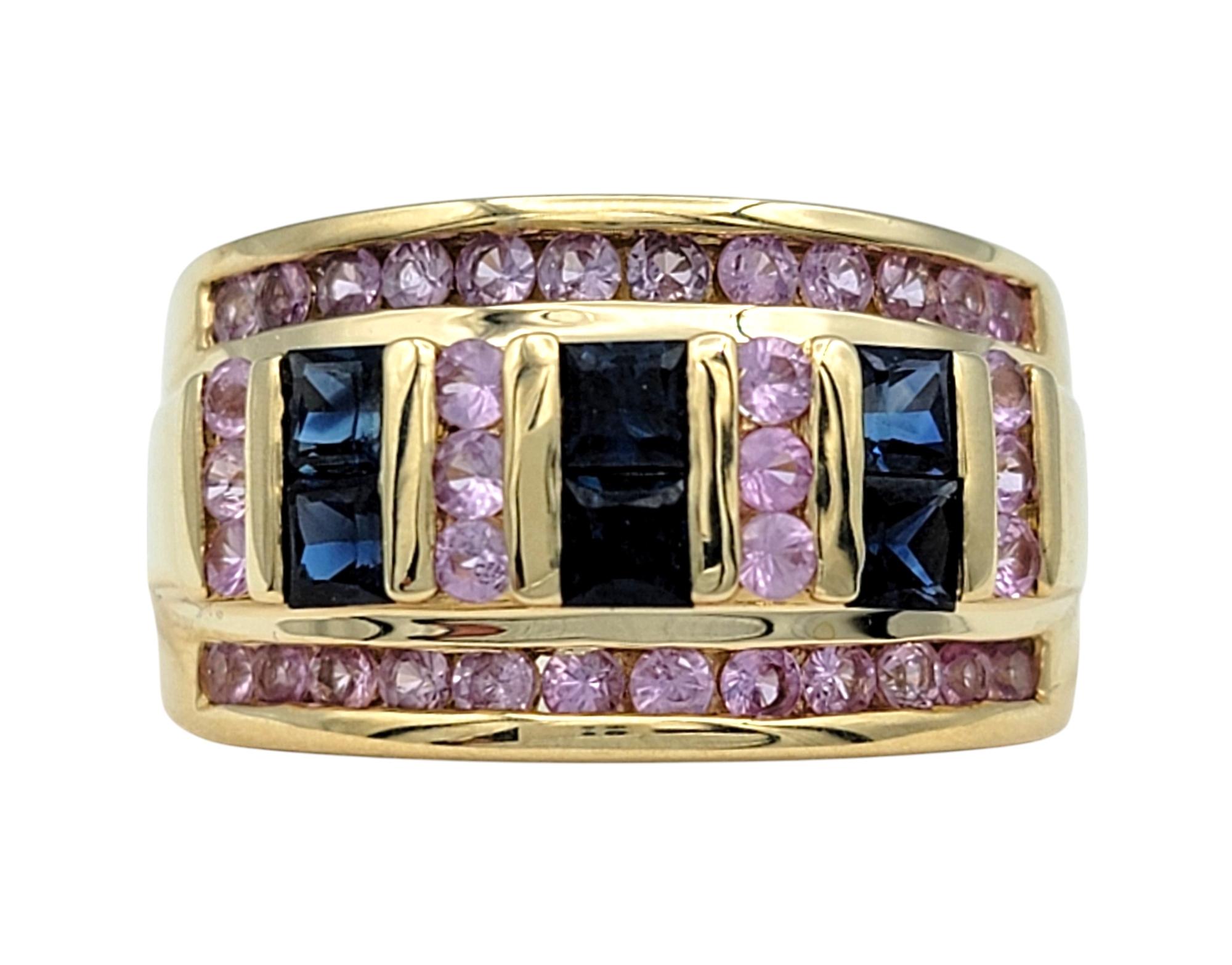 Ring Size: 7

This vibrant multi-color sapphire ring is a captivating celebration of color and elegance. Showcasing a stunning array of natural pink and blue sapphires, the combination of princess and round cuts creates a dynamic and eye-catching