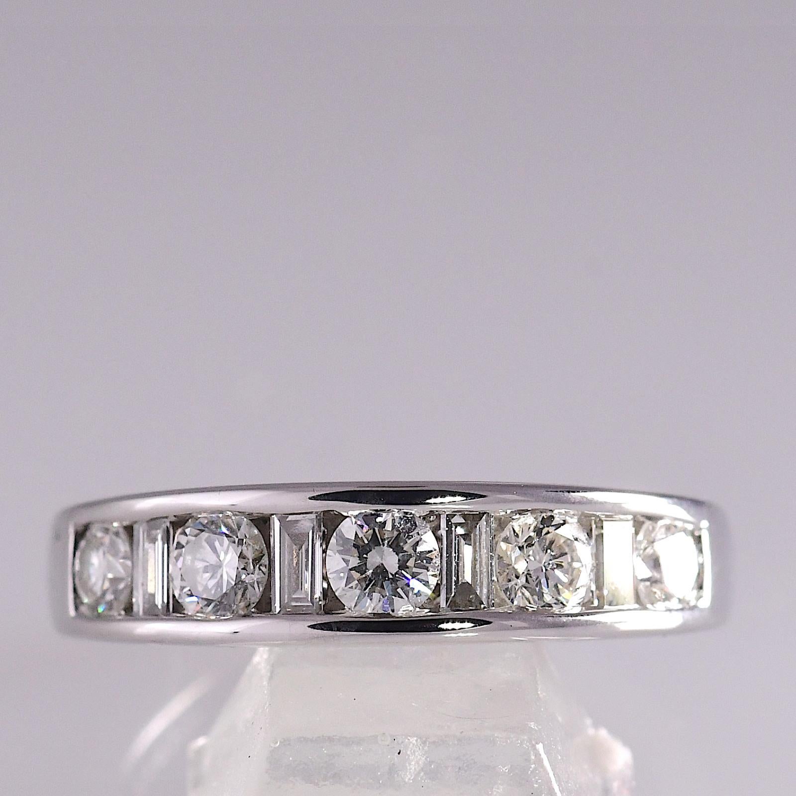 .72 TCW Natural Diamond White Gold 14K Anniversary Band 4.60 grams

Stones: Natural Diamond   TCW: .72   Color: H-K   Clarity: VS1-SI2   
Shape: Round / Baguette 
Metal: White Gold 
Purity: 14K 
Style: Anniversary/Wedding Band 
Total Gram Weight: