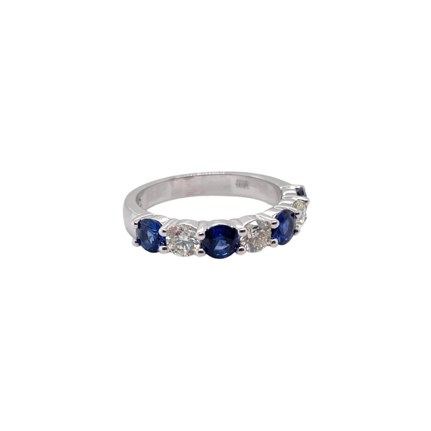 Ring contains 4 alternating round brilliant sapphires, 1.15tcw and 3 round brilliant diamonds, 0.63tcw. Diamonds are near colorless and VS2 in clarity, excellent cut. All stones are mounted in a basket prong setting. Ring is a size 6.75 and can be