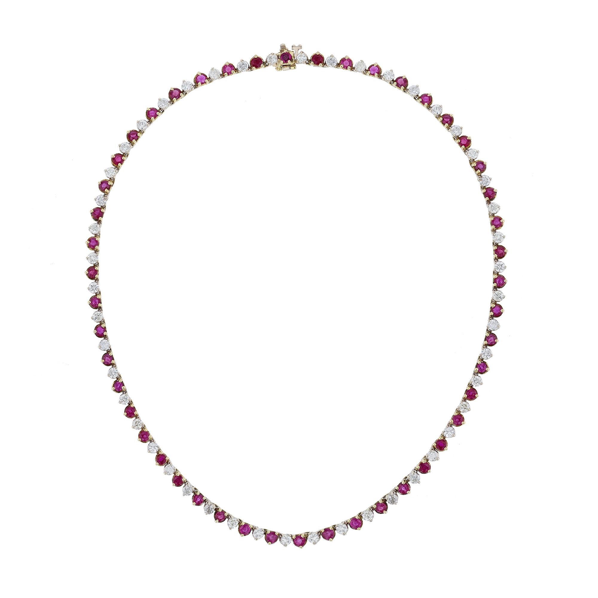 This collar necklace is made in 18K white and yellow gold. It features 50 rubies weighing 9.87 carats. As well as 50 diamonds 5.80 carats. Necklace has a color grade (H). and clarity grade (SI2). All stones are prong set.

