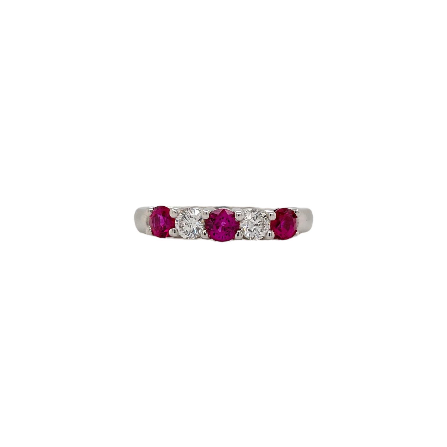 Ring contains alternating 3 round brilliant rubies, 0.70cts and 2 round brilliant diamonds, 0.28tcw. Diamonds are G in color and VS1 in clarity, excellent cut. All stones are mounted in prong settings. Ring is a size 6 and can be resized to desired