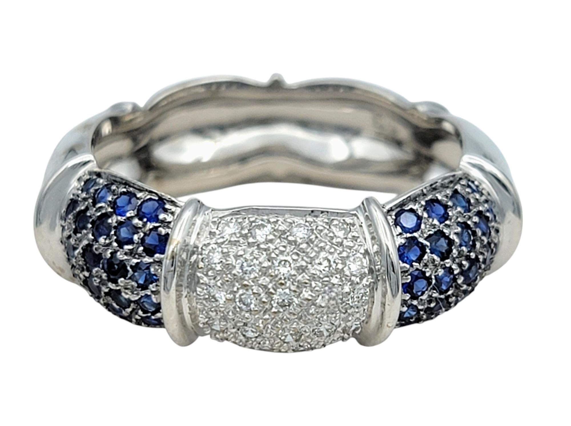 Ring Size: 7 

This stunning sapphire and diamond band ring is a luxurious expression of elegance and timeless beauty. The piece features a seamless blend of round brilliant diamonds and vibrant blue sapphires, alternating across the ring’s surface