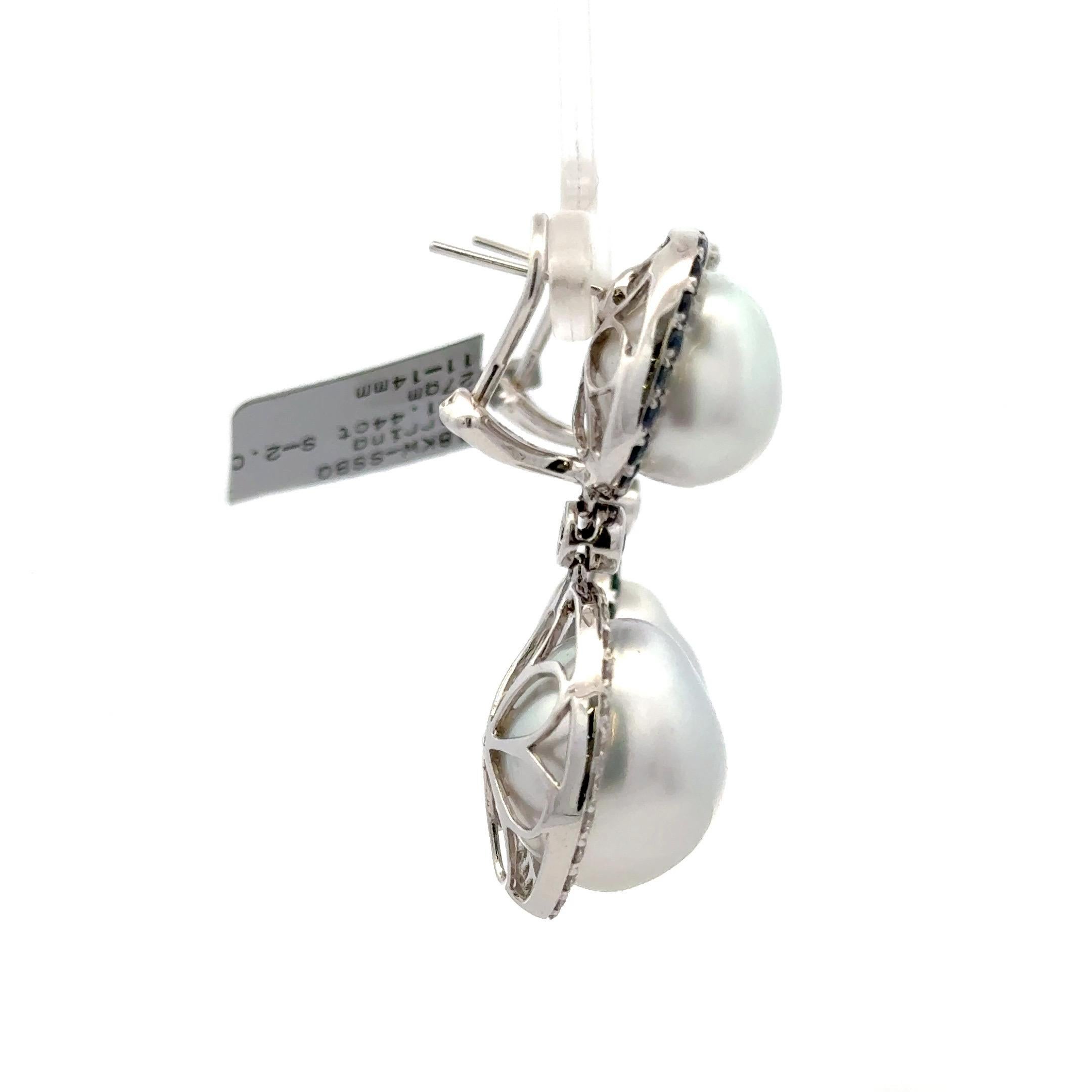 18 Karat white gold drop earrings featuring four Baroque pearls measuring 11-14 mm with  Sapphire & Diamond halo alternating halos. 
Diamonds - 1.44 Carats
Sapphires - 2 Carats