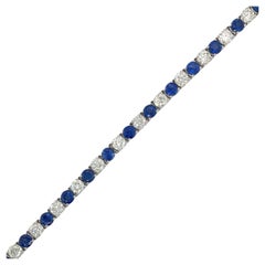 Bracciale tennis con zaffiri e diamanti alternati in oro bianco 14 carati